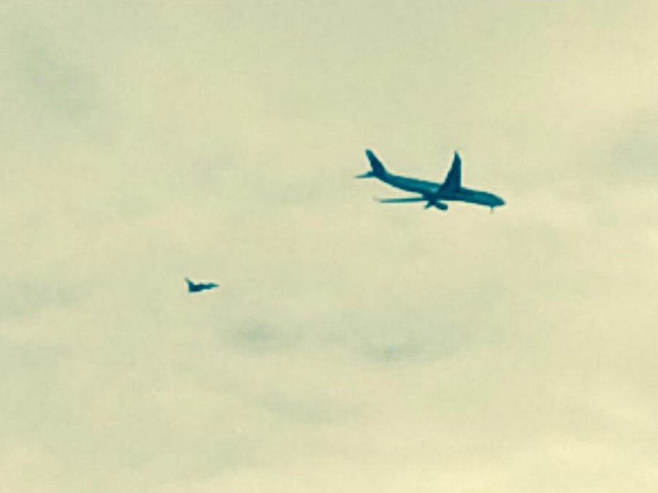 The plane being escorted to Manchester Airport. Picture: William Service