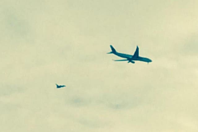 The plane being escorted to Manchester Airport. Picture: William Service