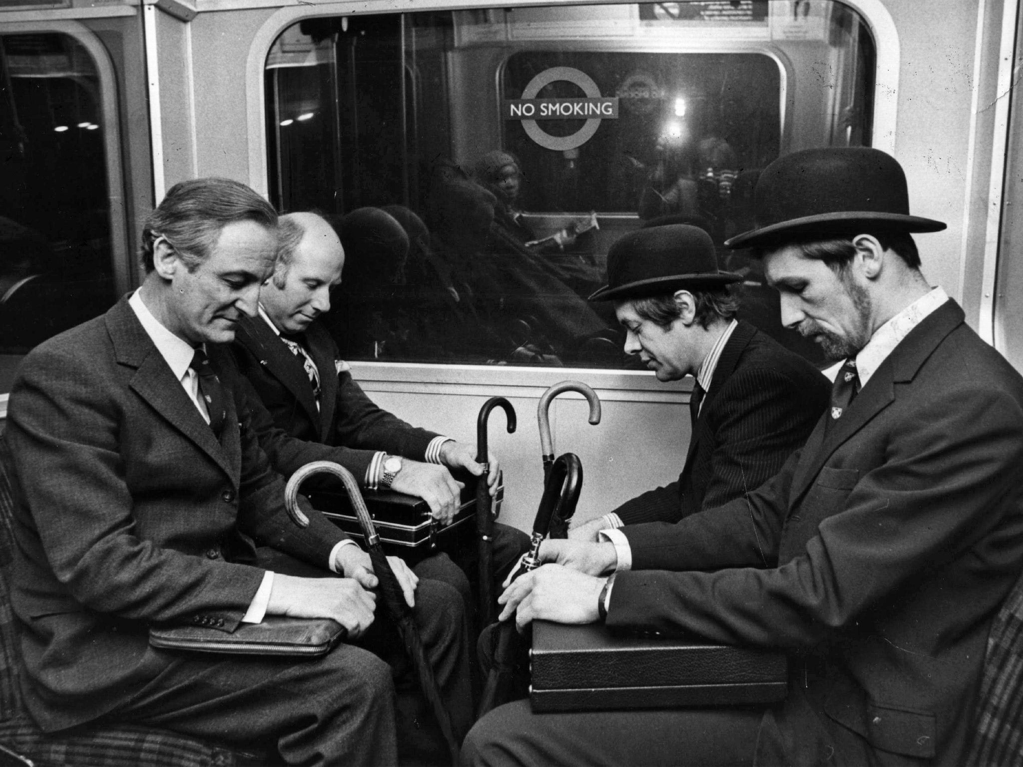 Suits you, sir: the days of the Englishman travelling to work in silence (Getty)