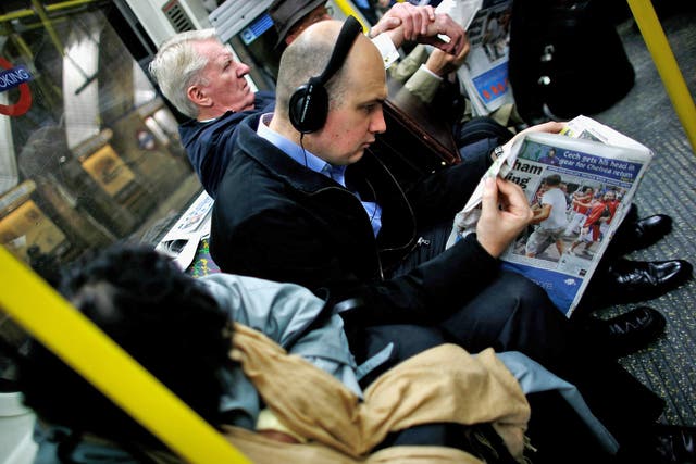 Headphones allow commuters to cut themselves off from the ambient soundscape (Getty)