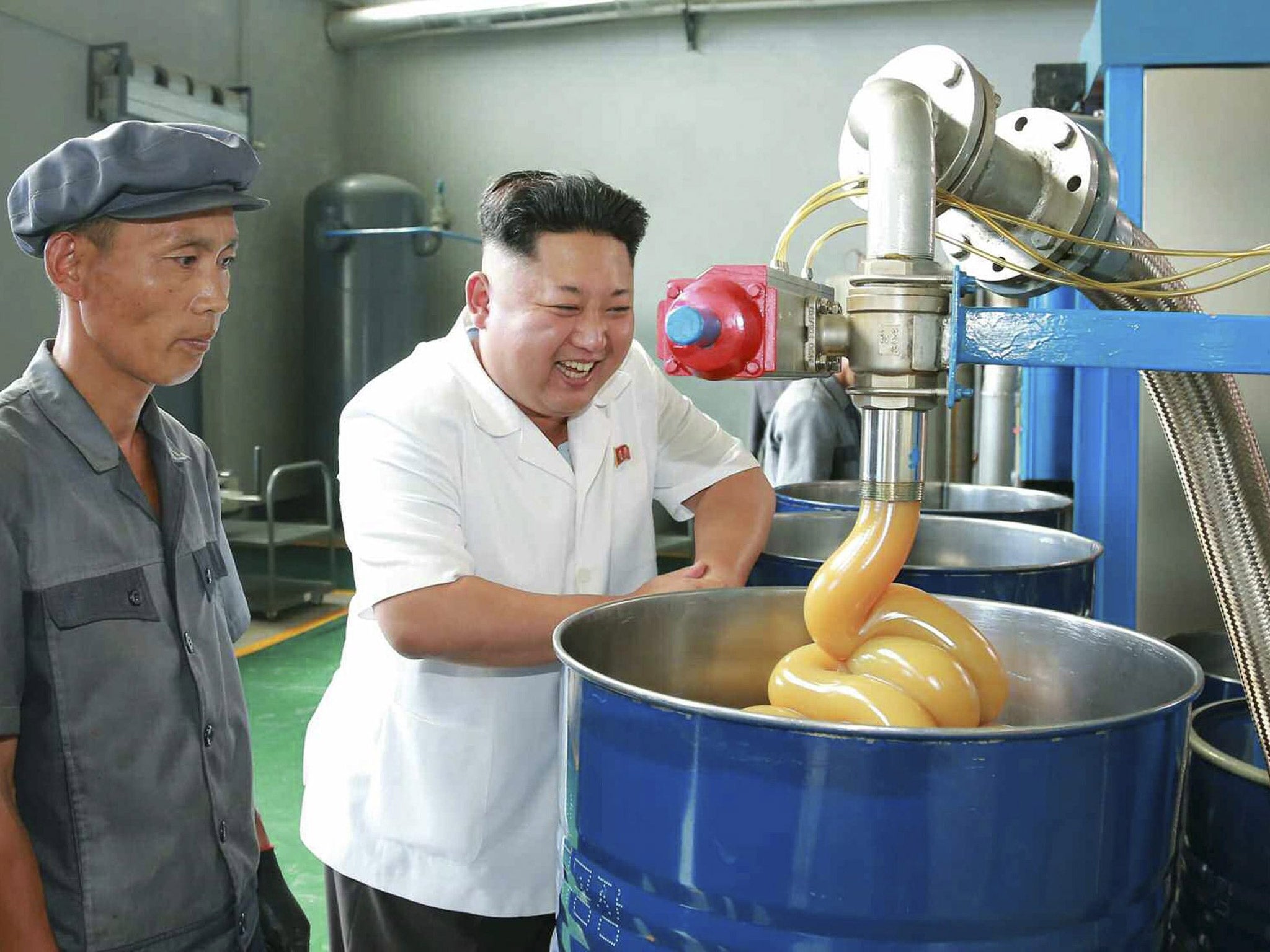 Kim Jong-un poses at a factory visit