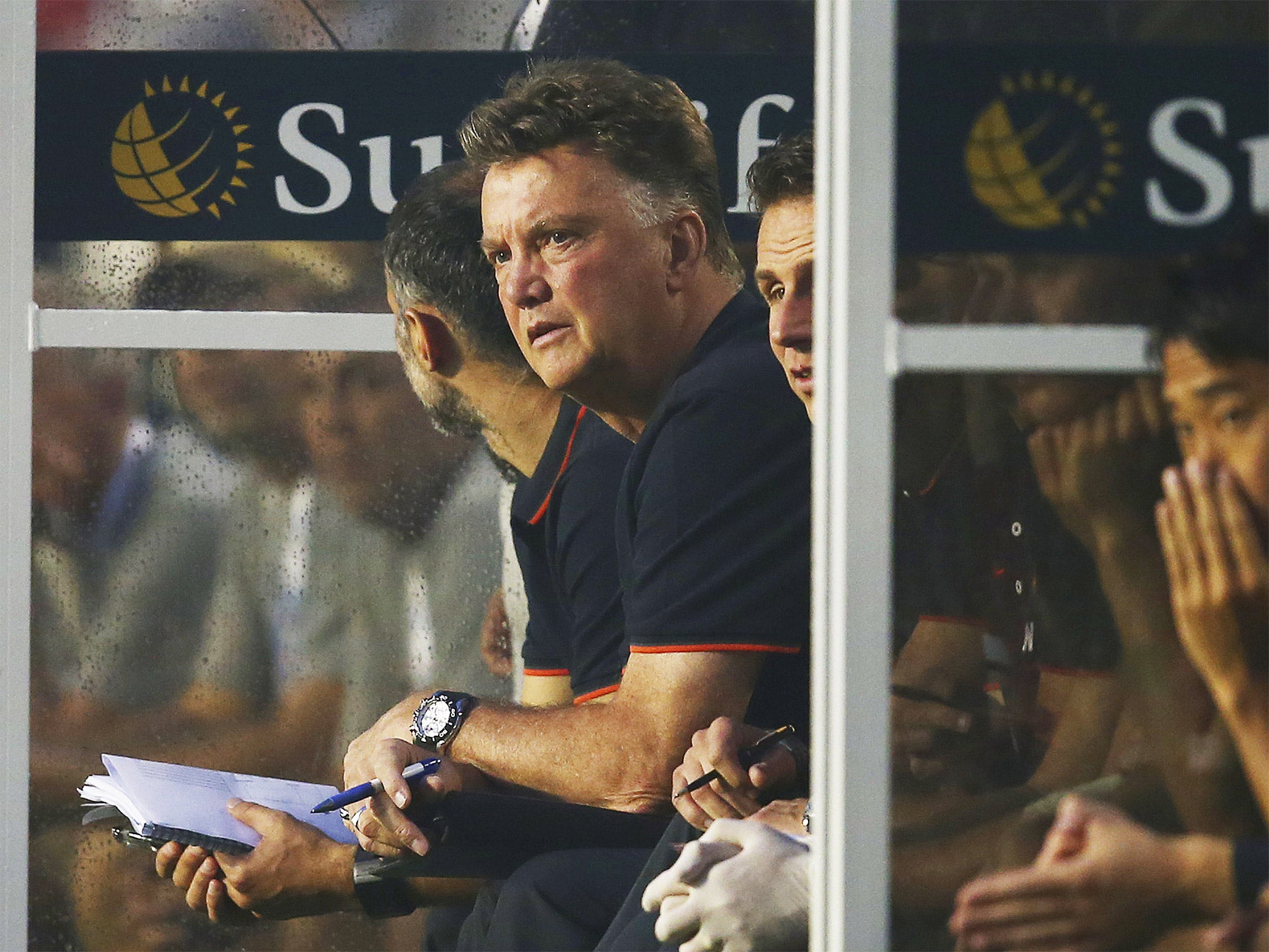 Louis van Gaal watches on from the bench during Manchester United's victory over Liverpool in Miami