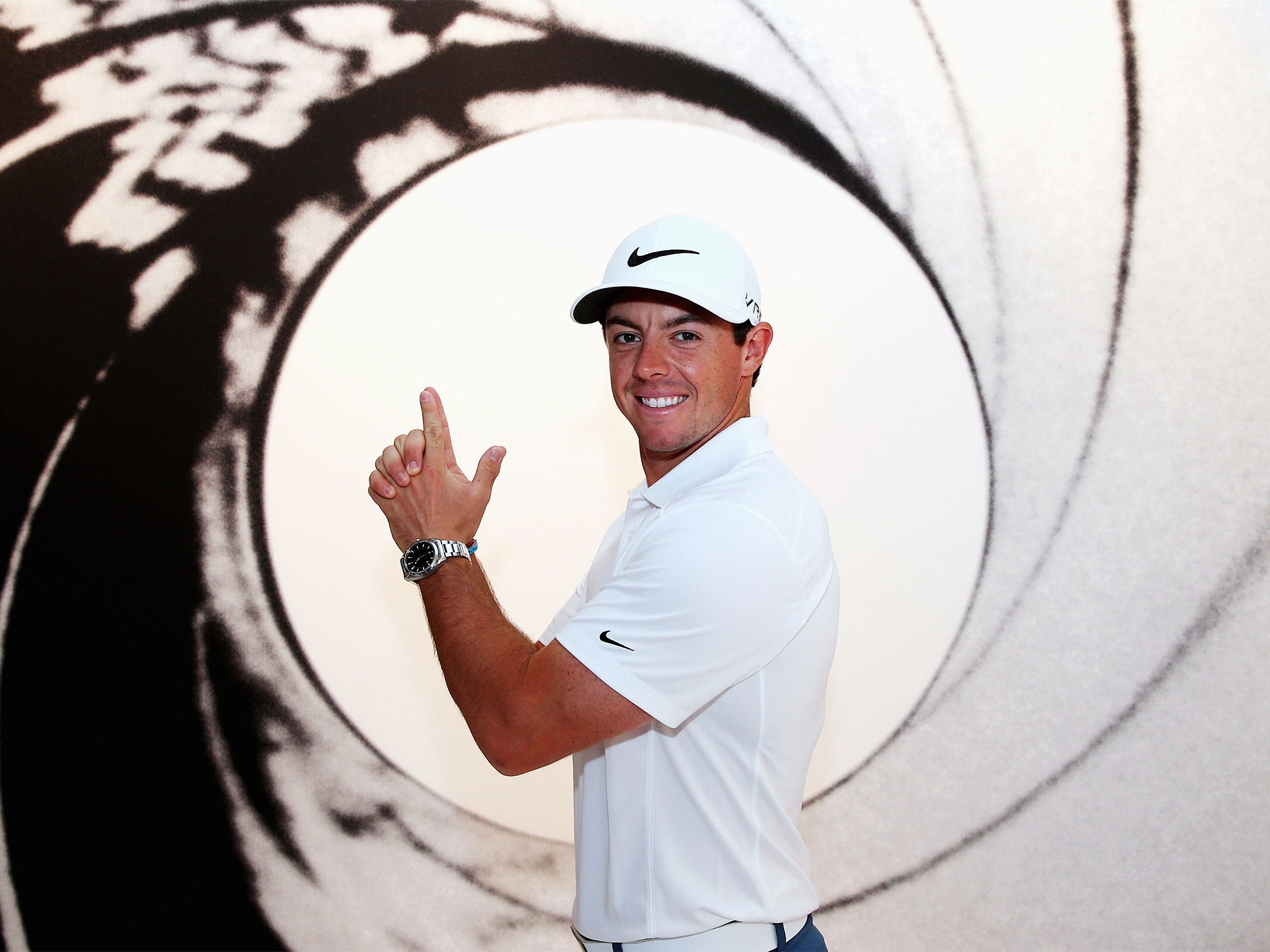 Licence to thrill: Rory McIlroy celebrates returning to No 1 in the world by adopting a familiar pose ahead of the US PGA