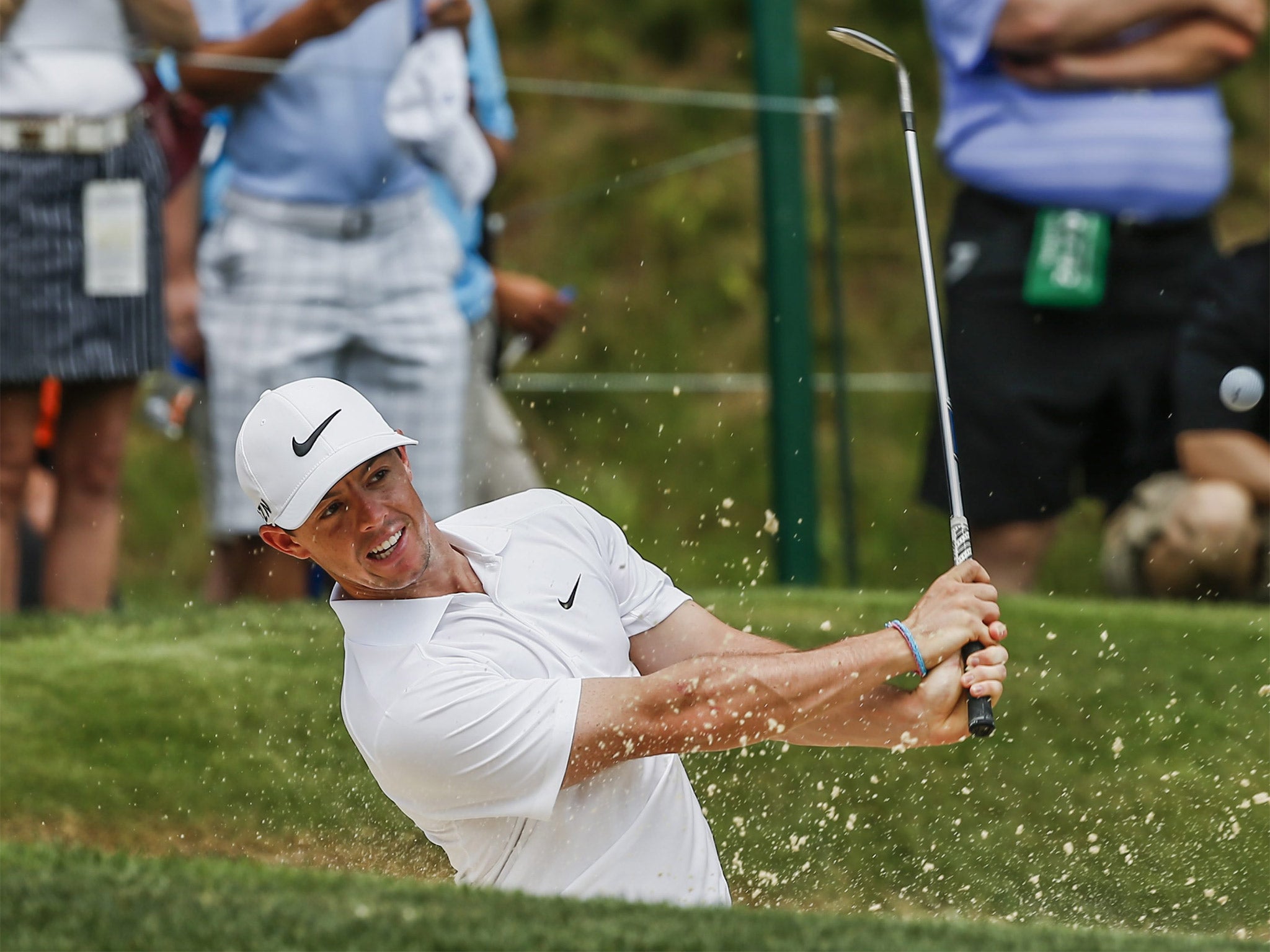 Rory McIlroy plays out of a bunker during a practice round at Valhalla