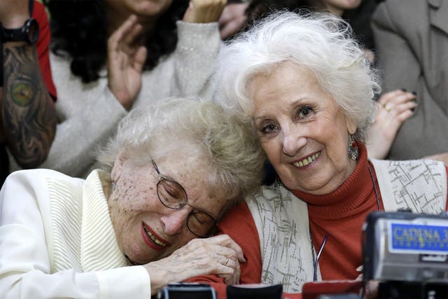 Human rights activist Estela de Carlotto (right) hugs Rosa de Roisinblit at a news conference in Buenos Aires 
