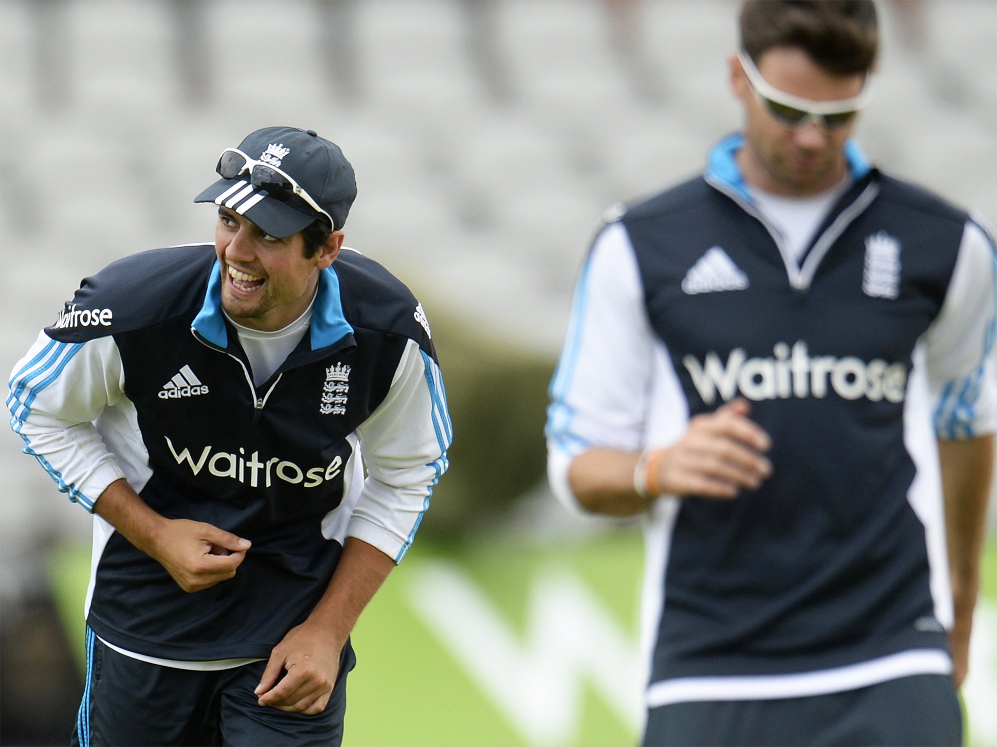 England captain, Alastair Cook (left), has a laugh as he warms up with Jimmy Anderson at Old Trafford