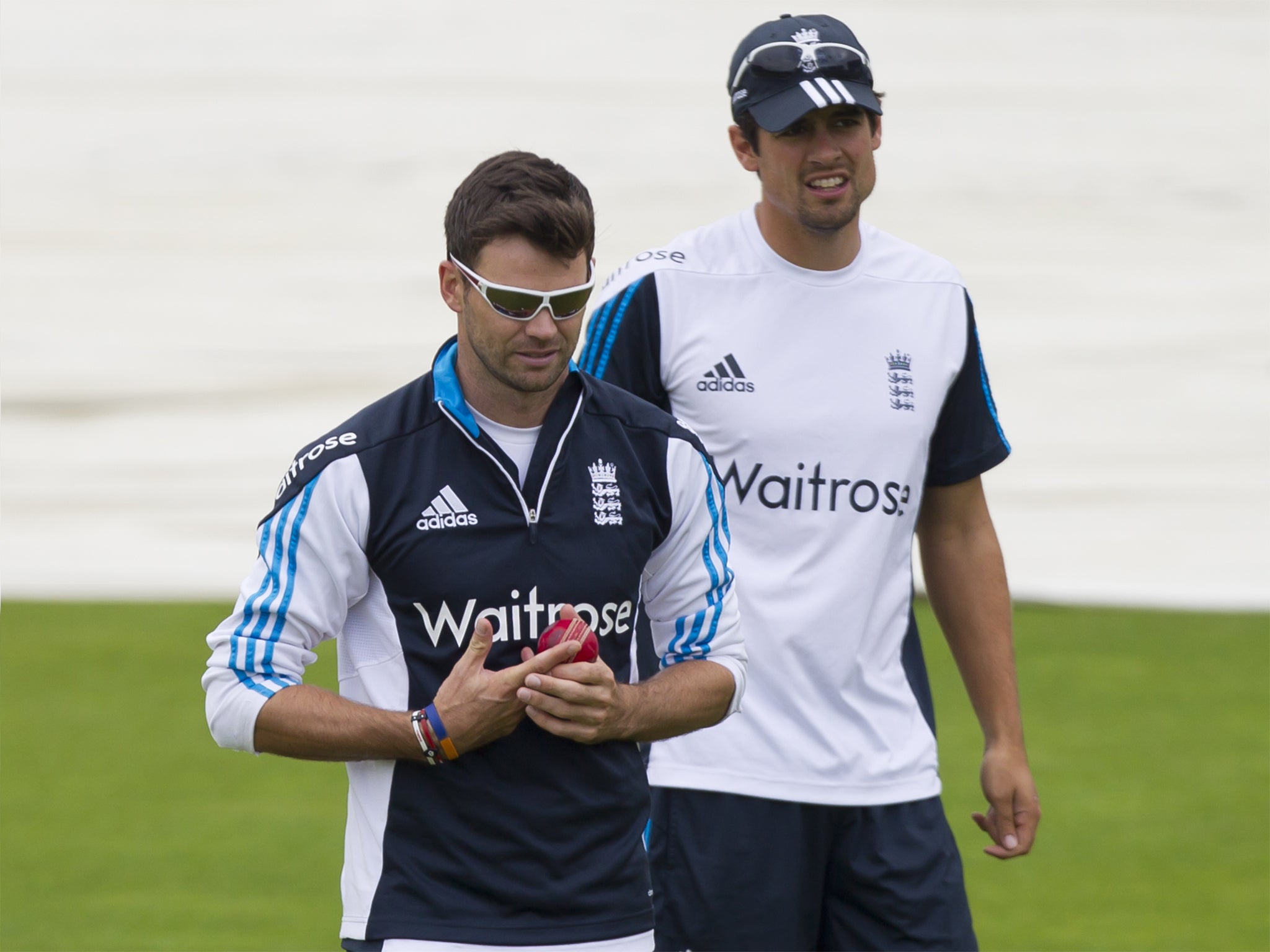 James Anderson walks alongside Alastair Cook before a nets session at Old Trafford