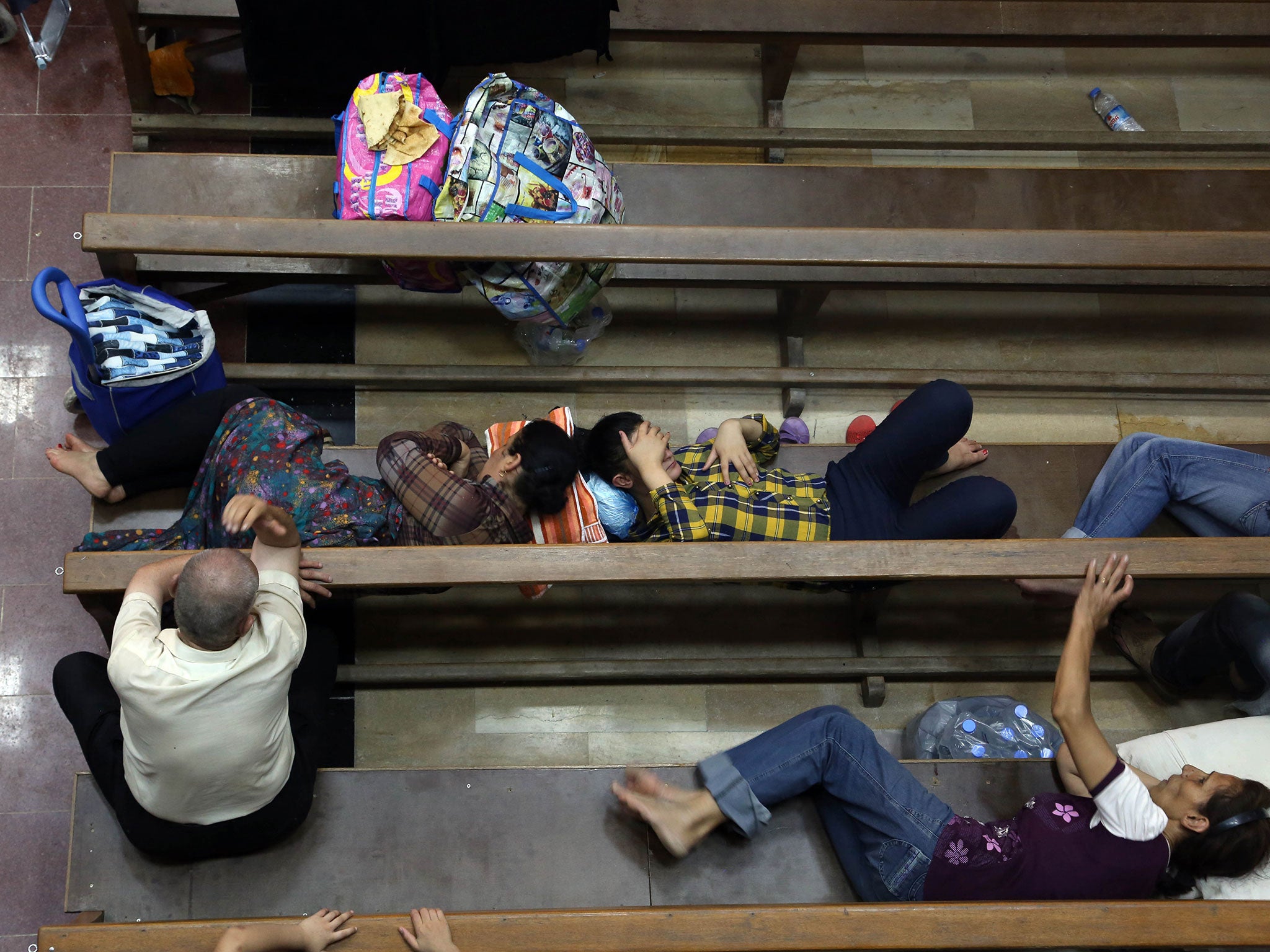 Displaced Iraqi Christians settle at St. Joseph Church in Irbil, northern Iraq