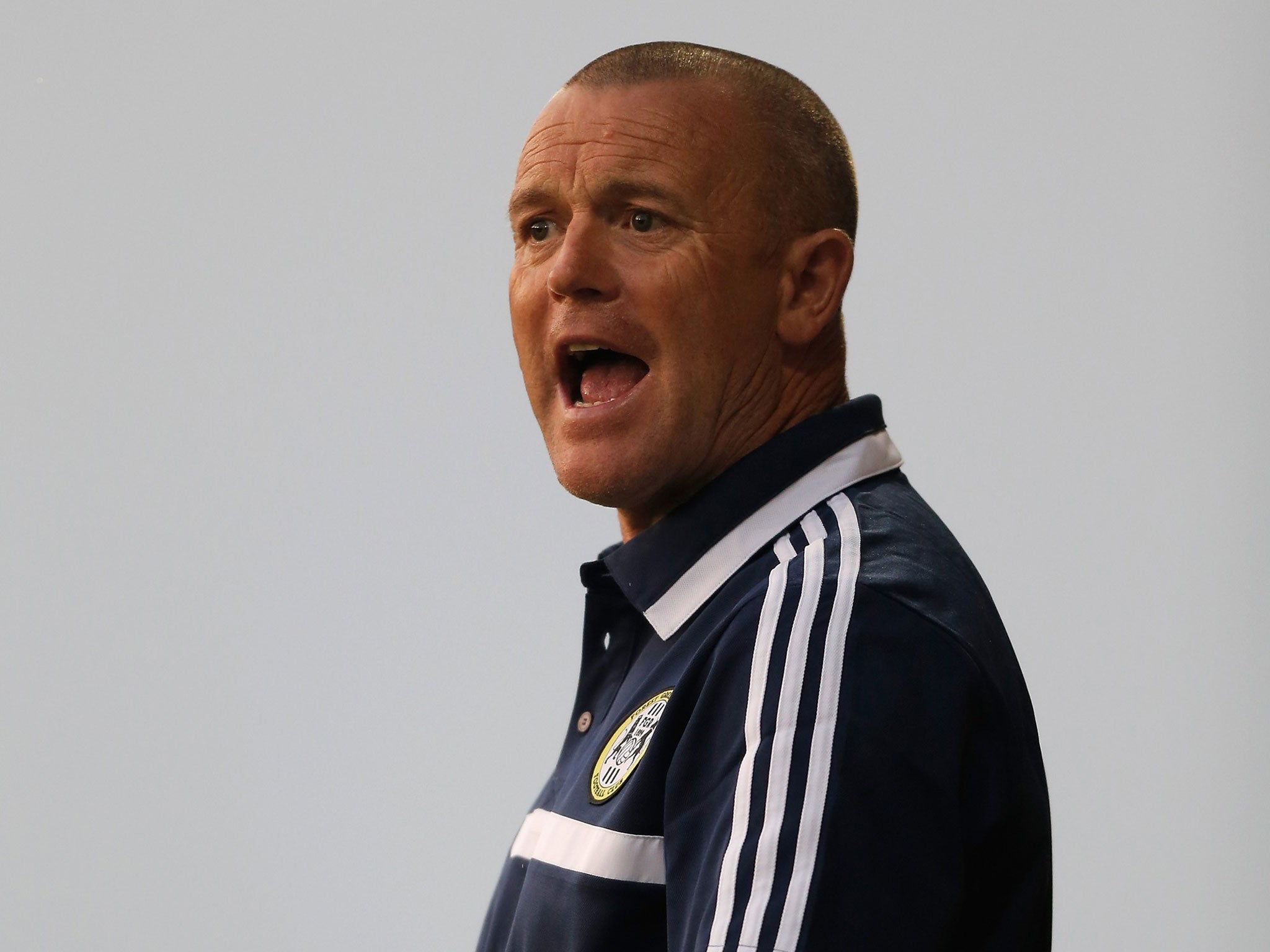 Dave Hockaday has no problem with not wearing purple,
or avoiding the number 17