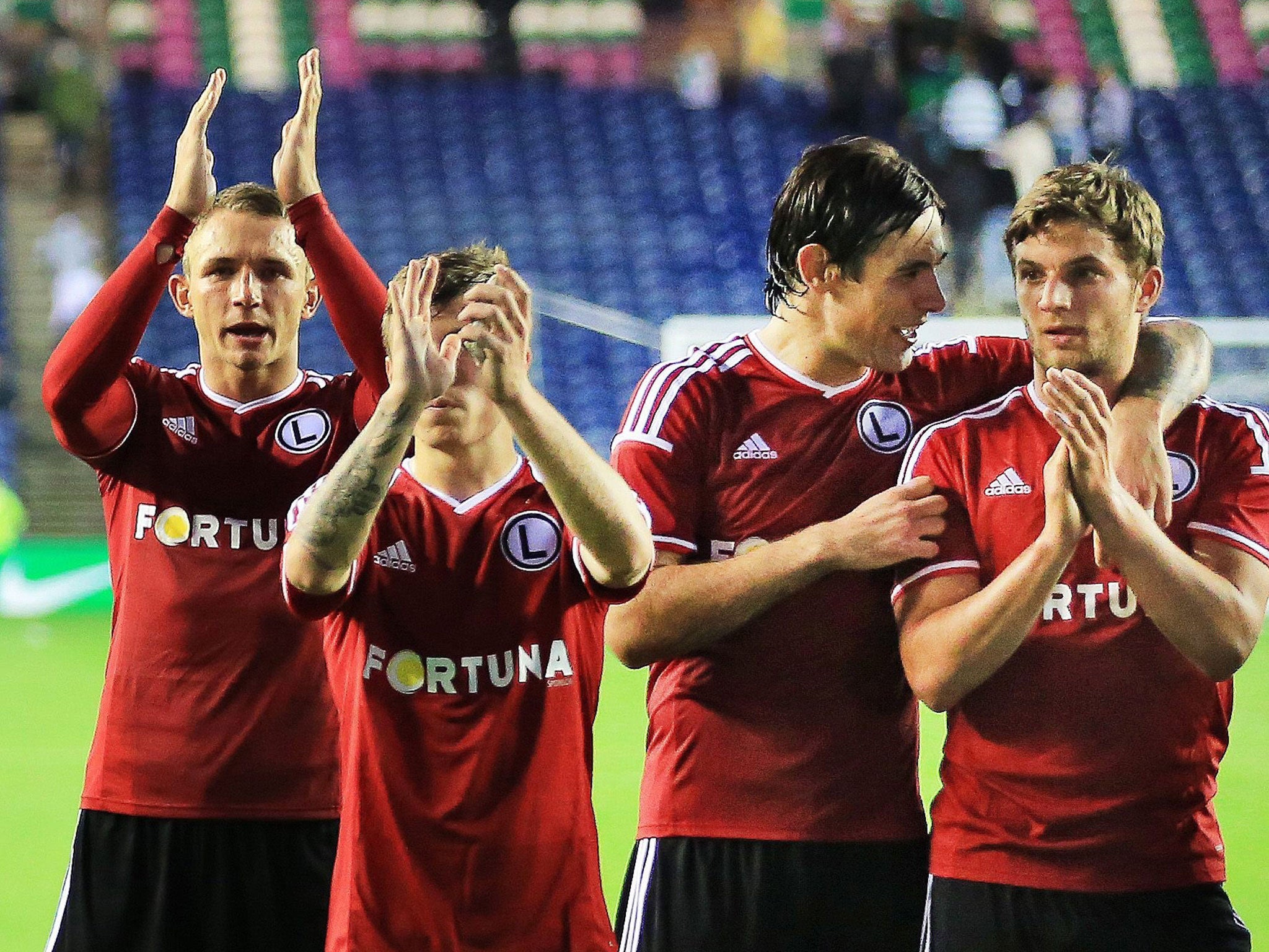 Bartosz Bereszynski (right) celebrates Legia Warsaw’s win at Murrayfield on Wednesday
