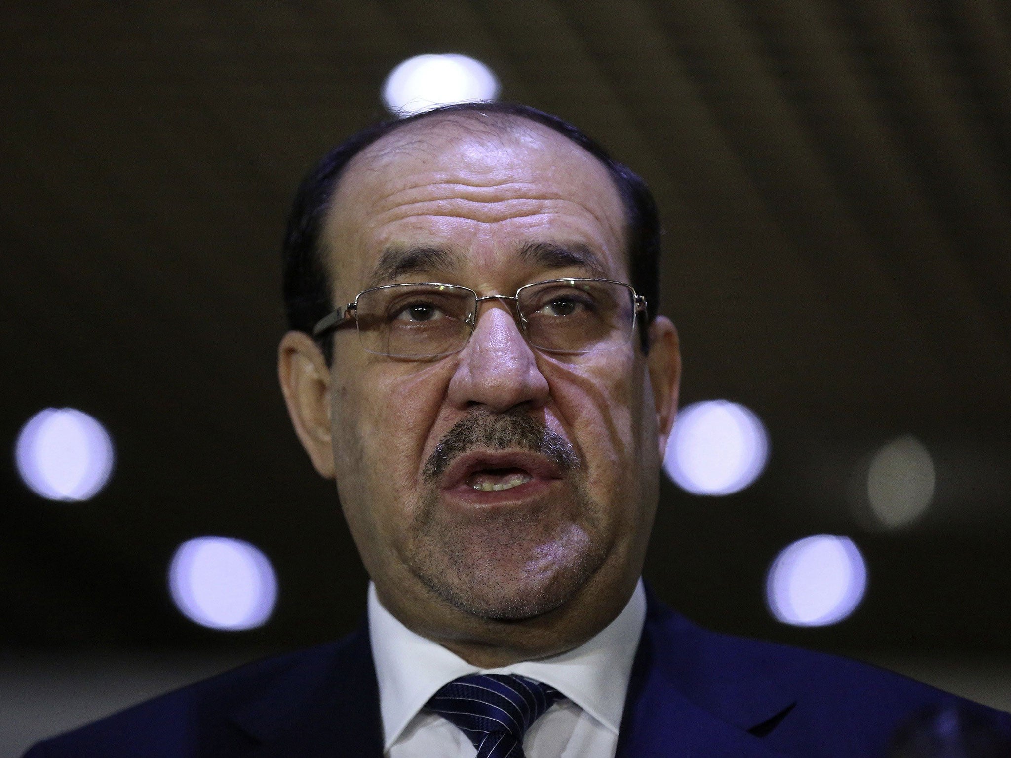 Nouri al-Maliki, Prime Minister of Iraq, clings on to power but is laying down conditions for his departure