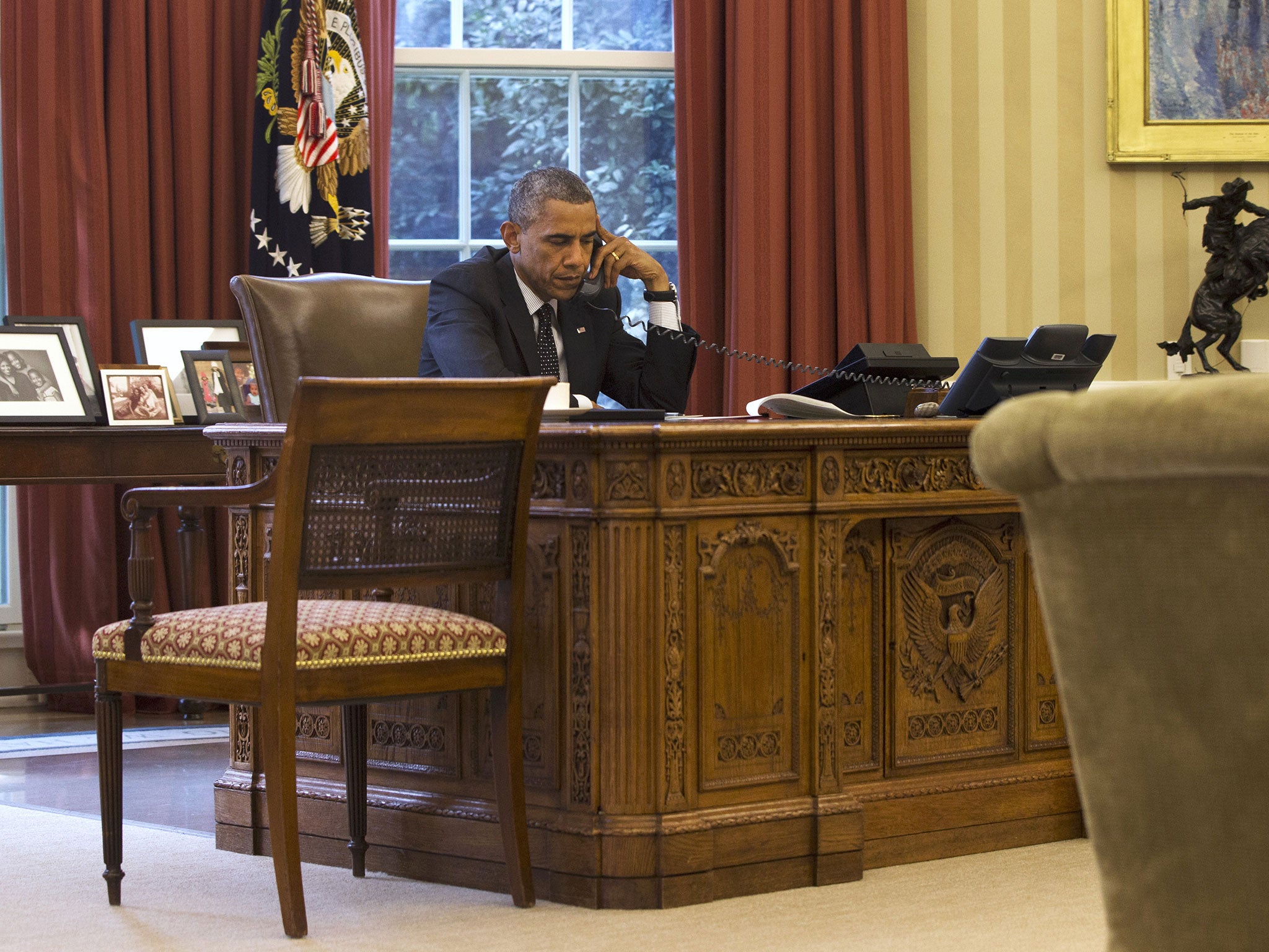 Barack Obama speaks to King Abdullah II of Jordan in the Oval Office yesterday