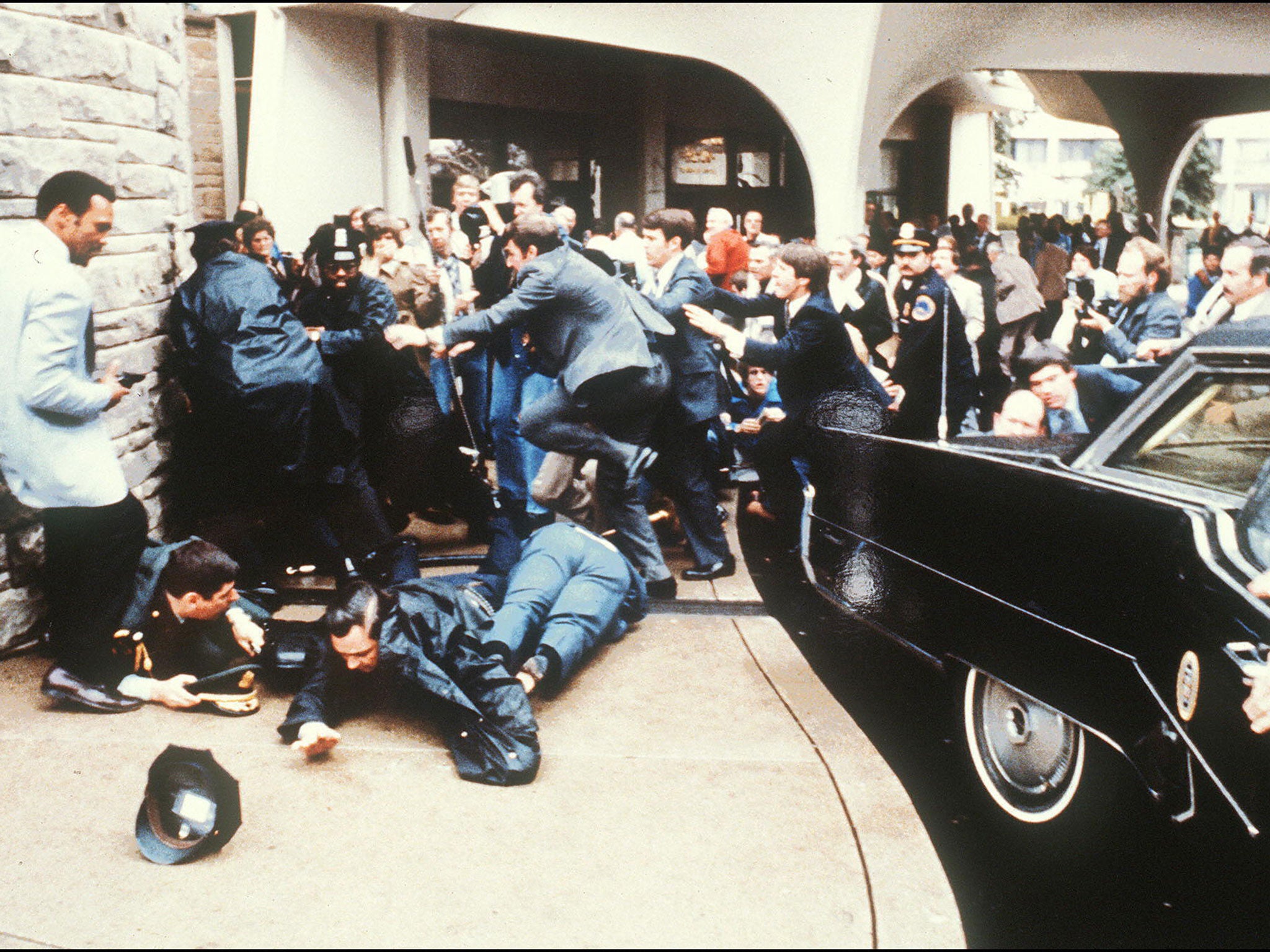 The Hilton Hotel in Washington, DC, shows police and Secret Service agents reacting during the assassination attempt on then US president Ronald Reagan