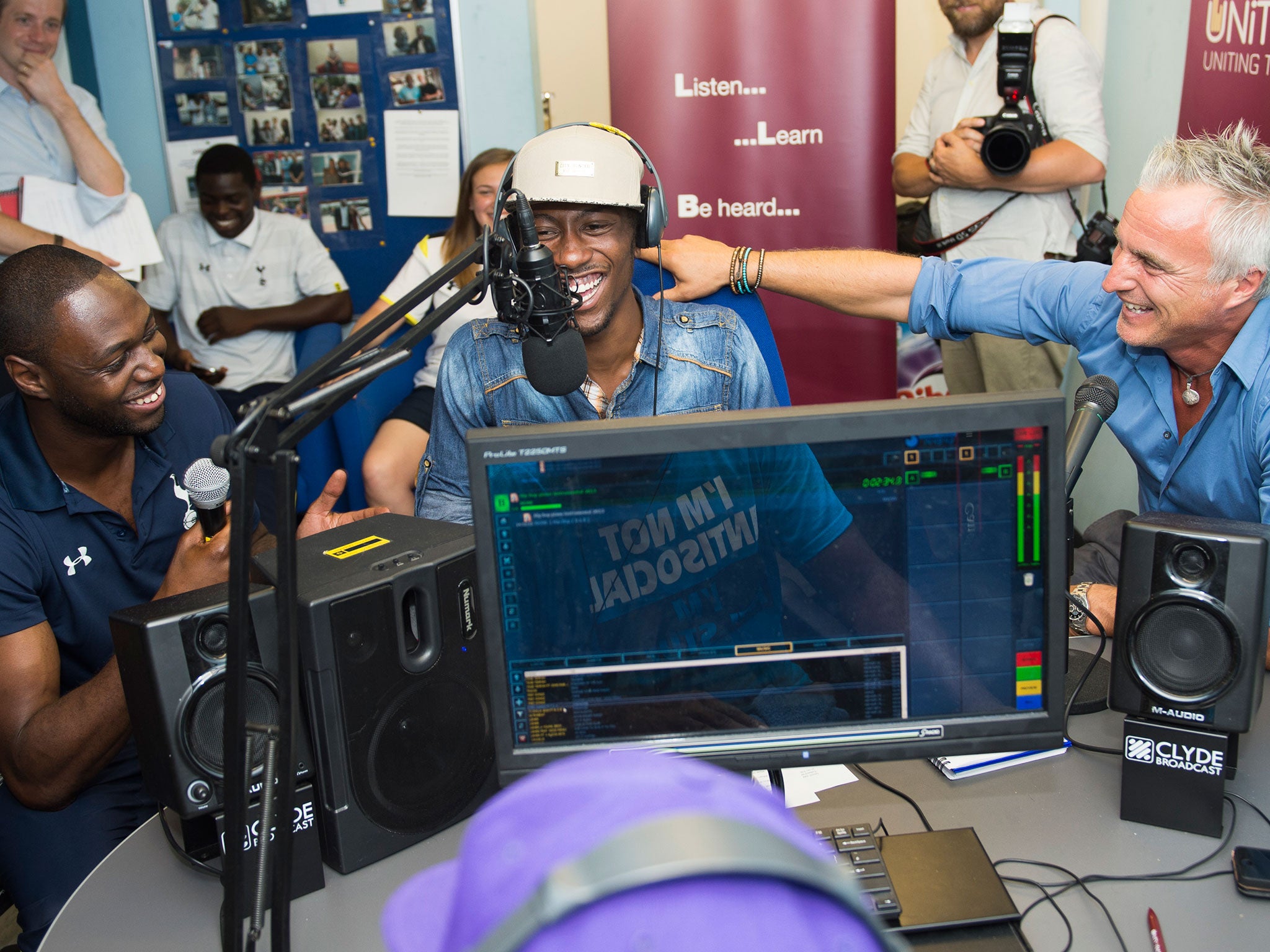 King and Ginola share a joke with one of the members of the program