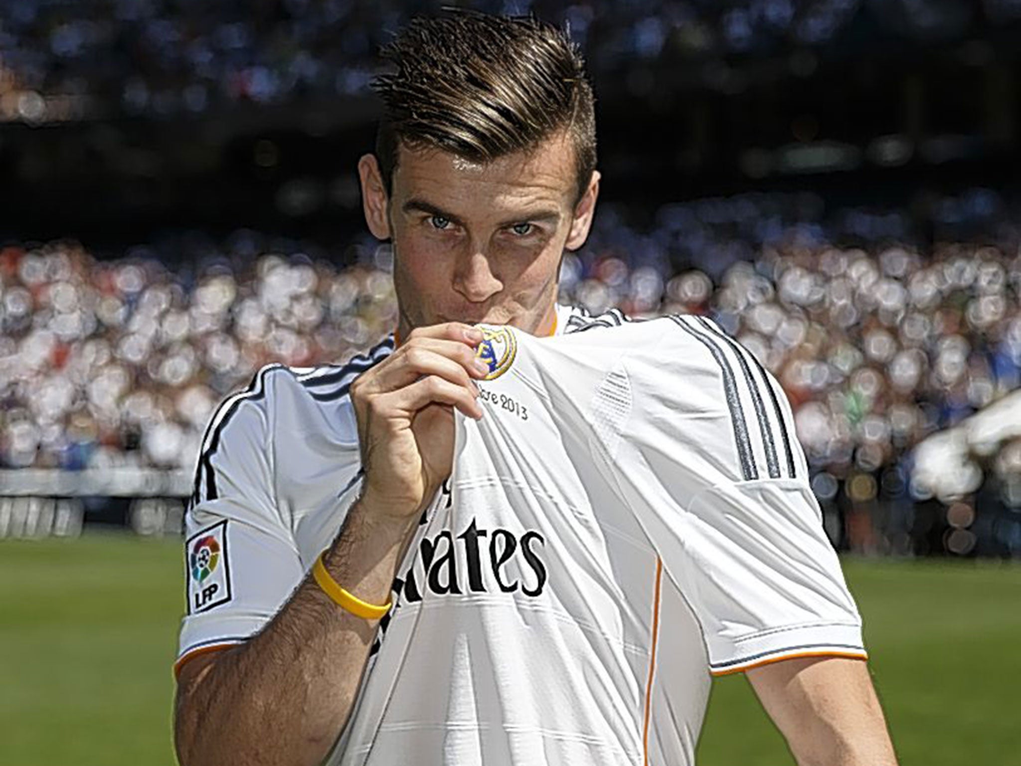 Kissing goodbye: The bogus act of affinity which is badge kissing, demonstrated here by Gareth Bale, should be a yellow-card offence