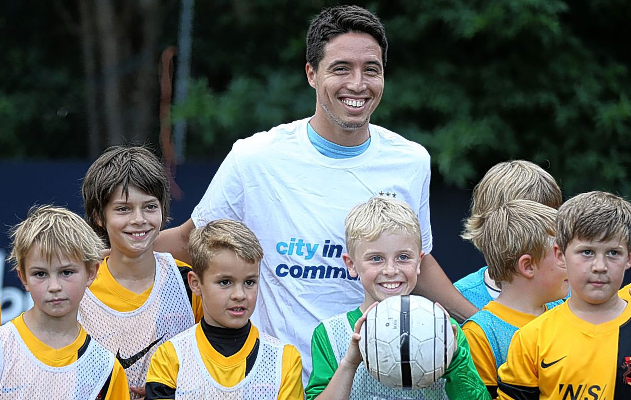 Nasri at Manchester City’s Community Shield media day helping the club’s community coaches train local children