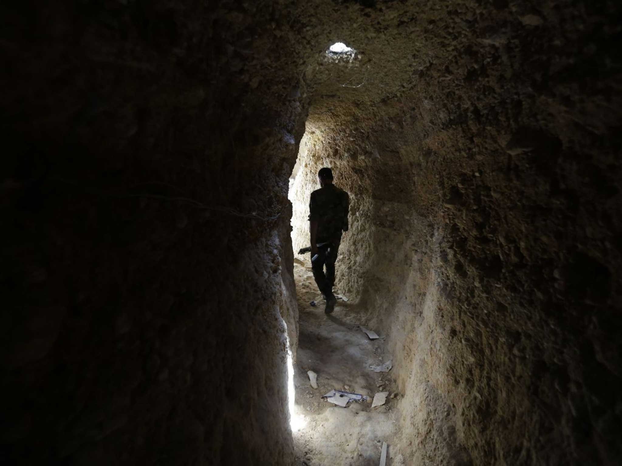 Enemy below: A Syrian soldier in a captured rebel tunnel under Jobar, east Damascus