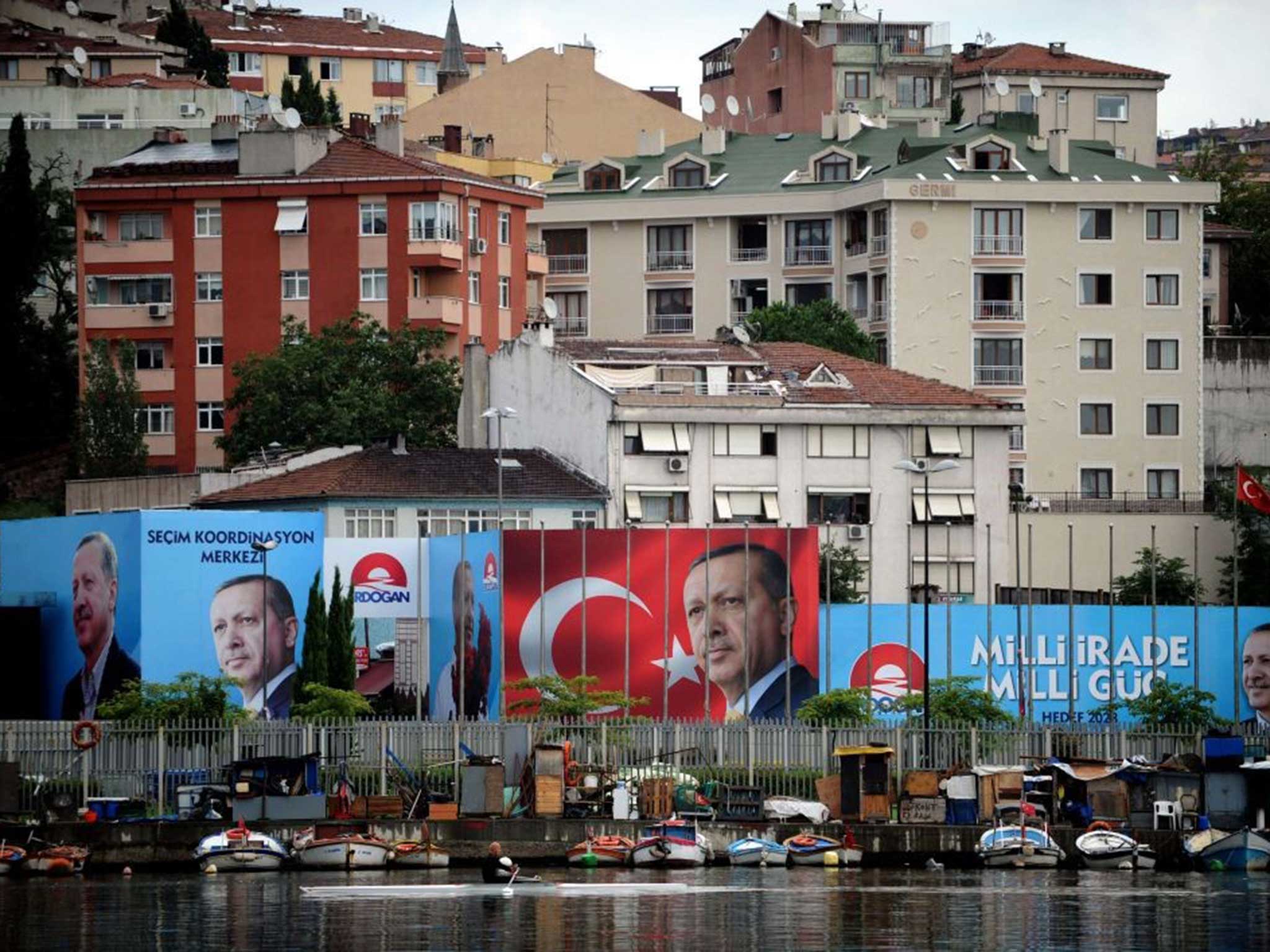 Victory in sight: Election posters for Recep Tayyip Erdogan have been plastered all over Istanbul