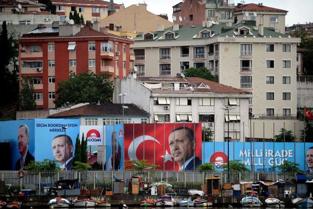 Victory in sight: Election posters for Recep Tayyip Erdogan have been plastered all over Istanbul 