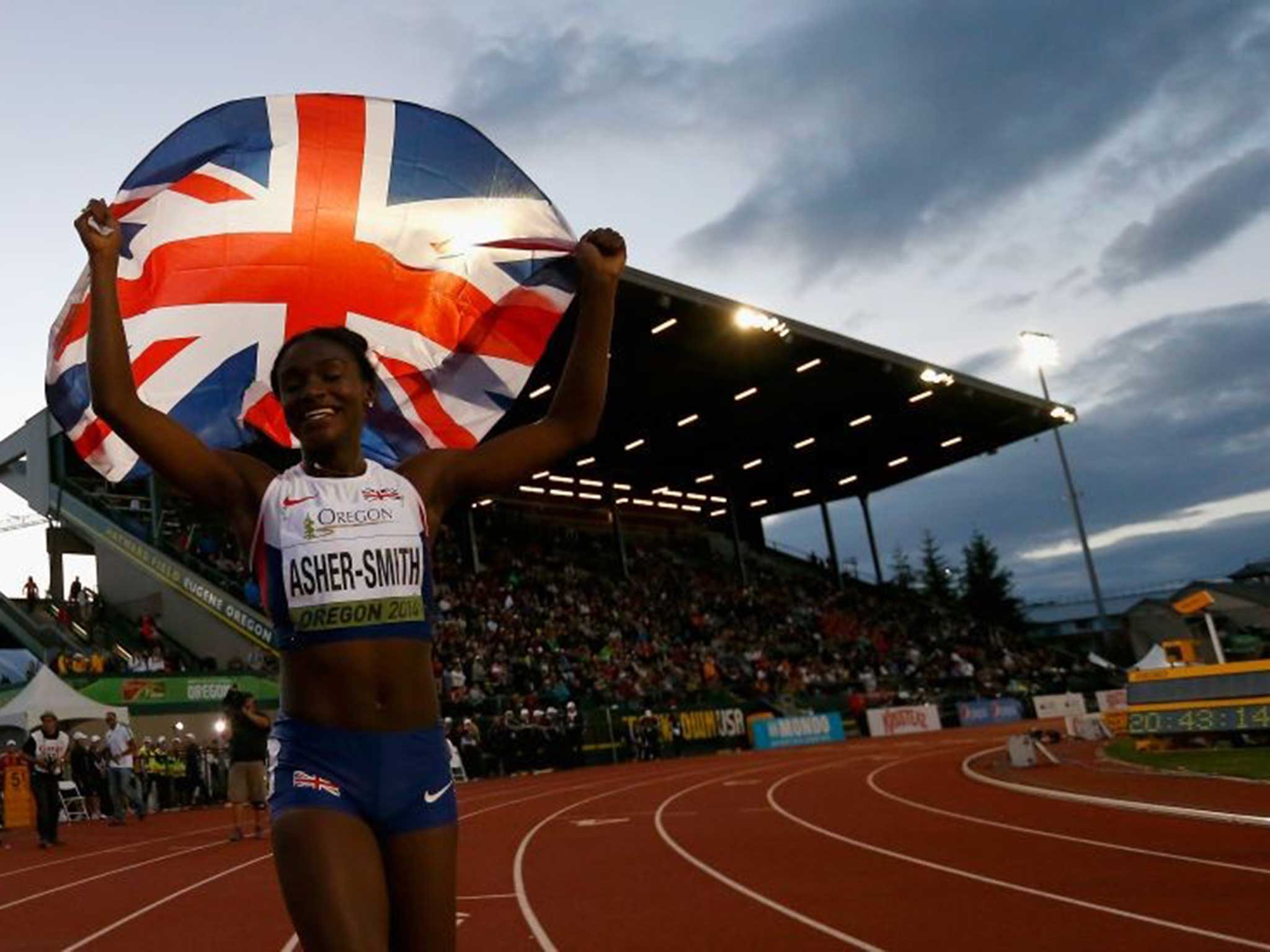 Golden girl: Dina Asher-Smith celebrates her win in the world junior championships in Oregon last month