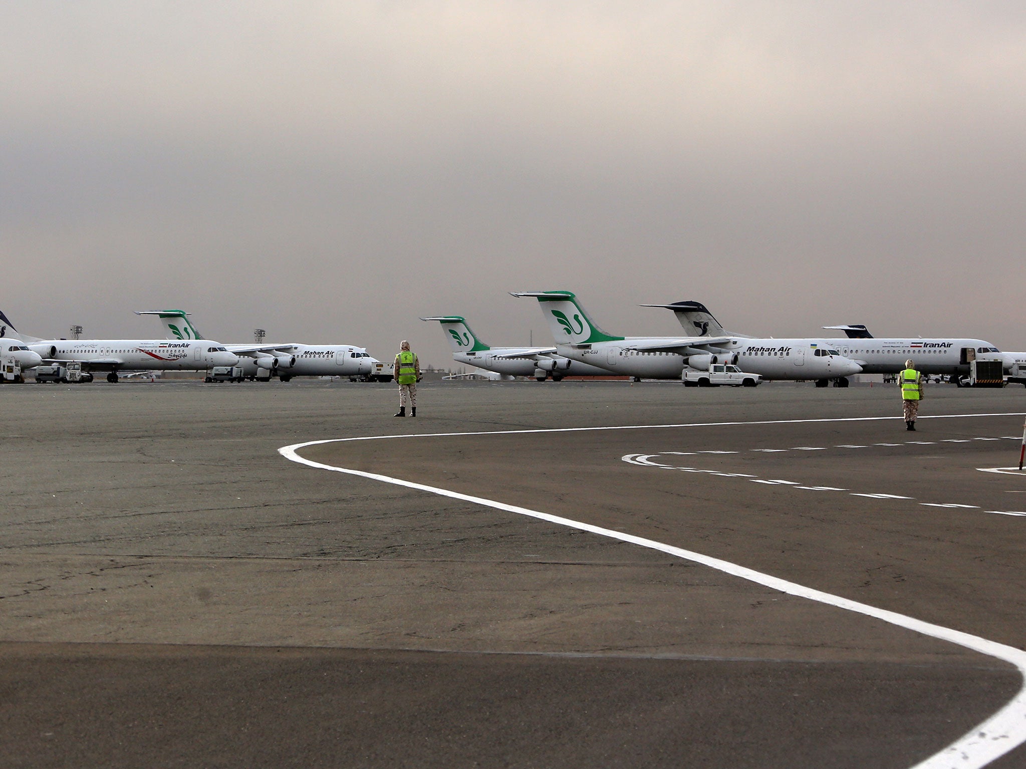 Iran Air and Mahan Air passenger planes sit on the tarmac of the domestic Mehrabad airport in the Iranian capital Tehran
