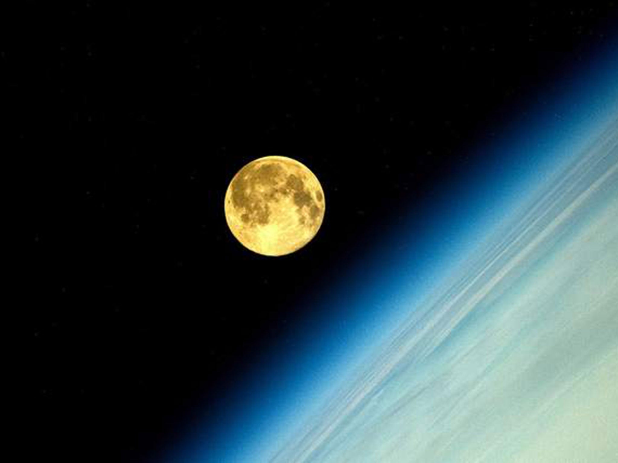 The pictures of the supermoon from space were taken by cosmonaut Oleg Artemyev