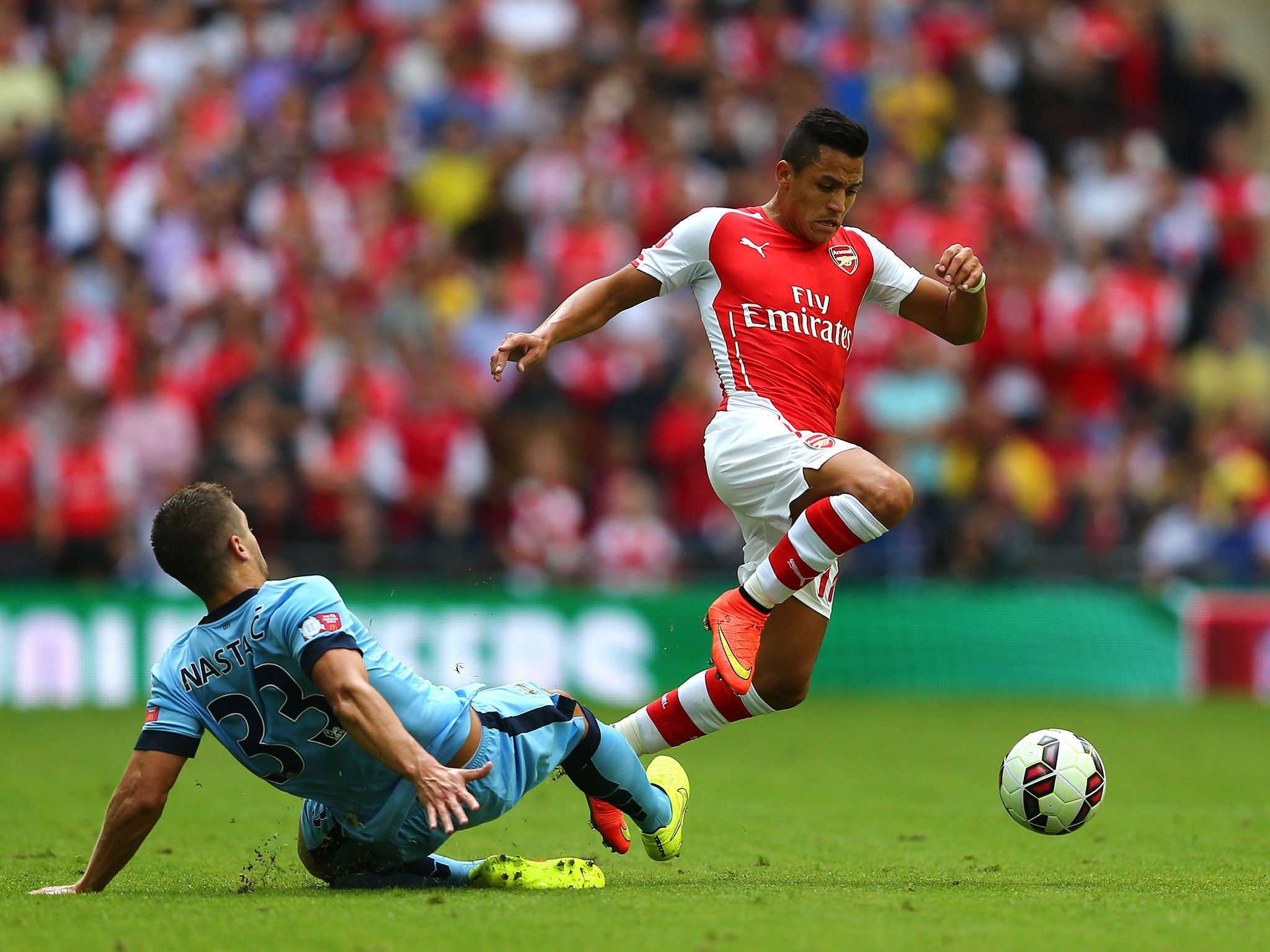 Alexis Sanchez powers past Matija Nastasic in the Community Shield