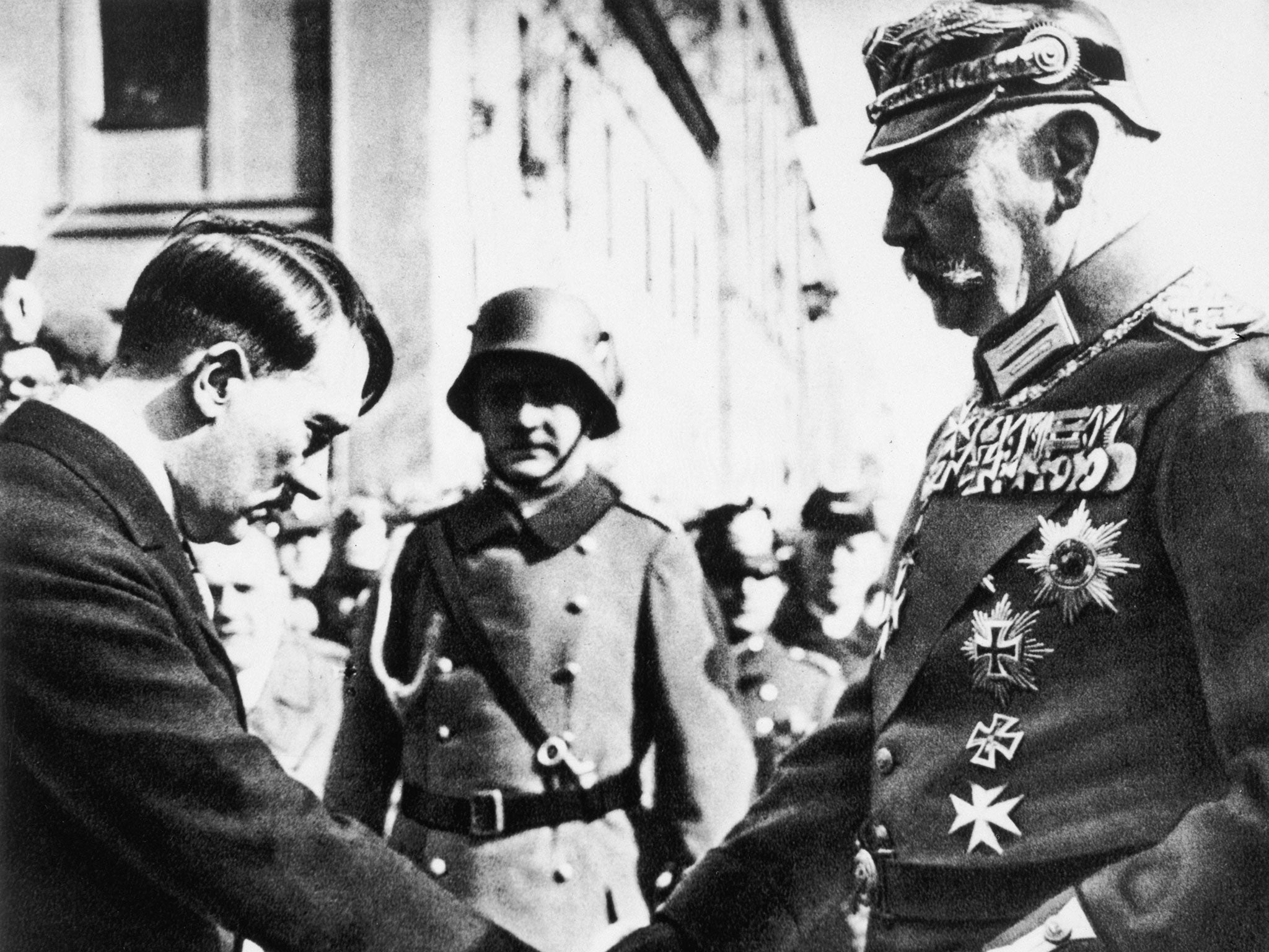 Paul von Hindenburg, the then President, shakes hands with Adolf Hitler at Potsdam’s Garrison Church in 1933