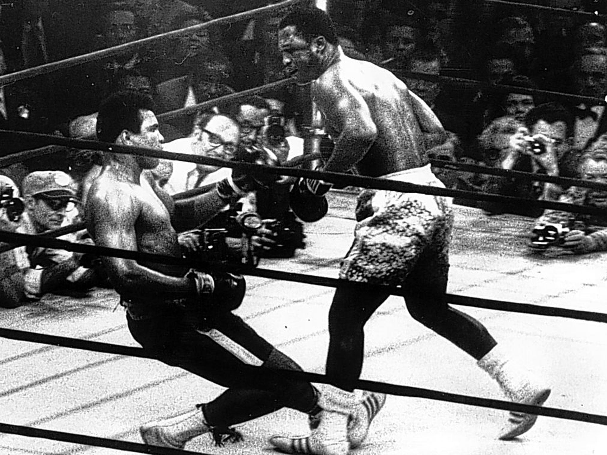 Muhammad Ali goes down in the 15th round against Joe Frazier during their epic encounter in 1971 at Madison Square Garden in New York, often now dubbed the fight of the century