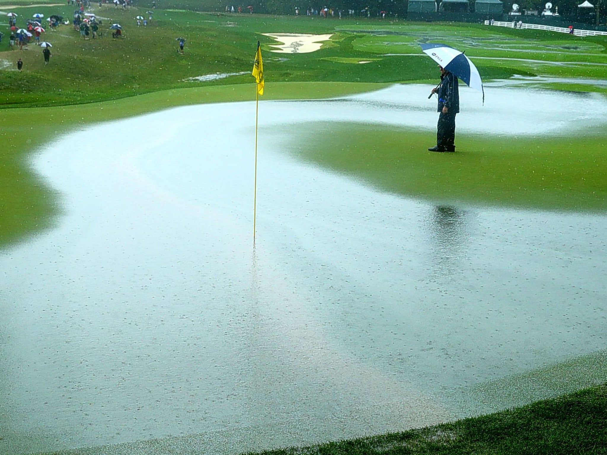 The heavily waterlogged ninth hole during today's downpour at Valhalla