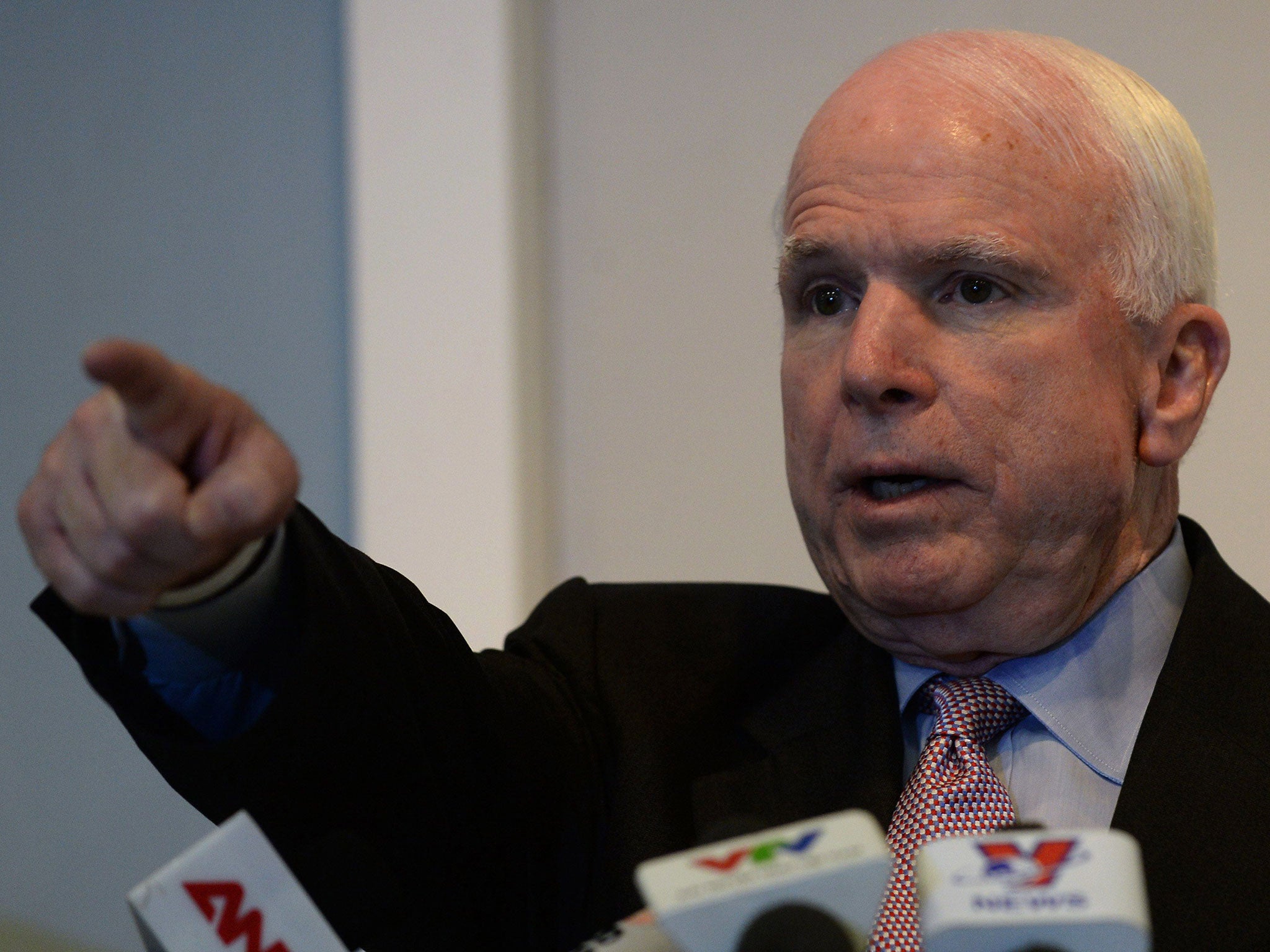 John McCain was caught playing poker on his iPhone