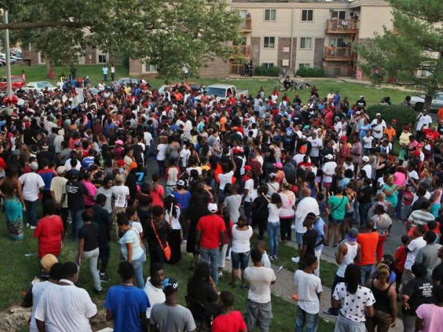 A large crowd gathers at the candlelight vigil on Sunday evening