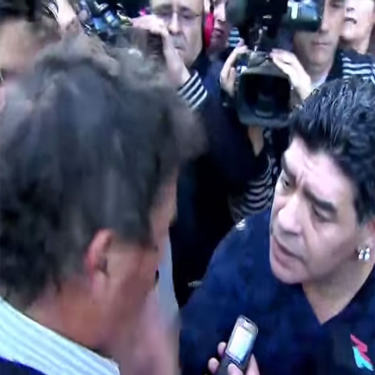 The hand of God strikes again: Maradona slaps a journalist in the face |  The Independent | The Independent