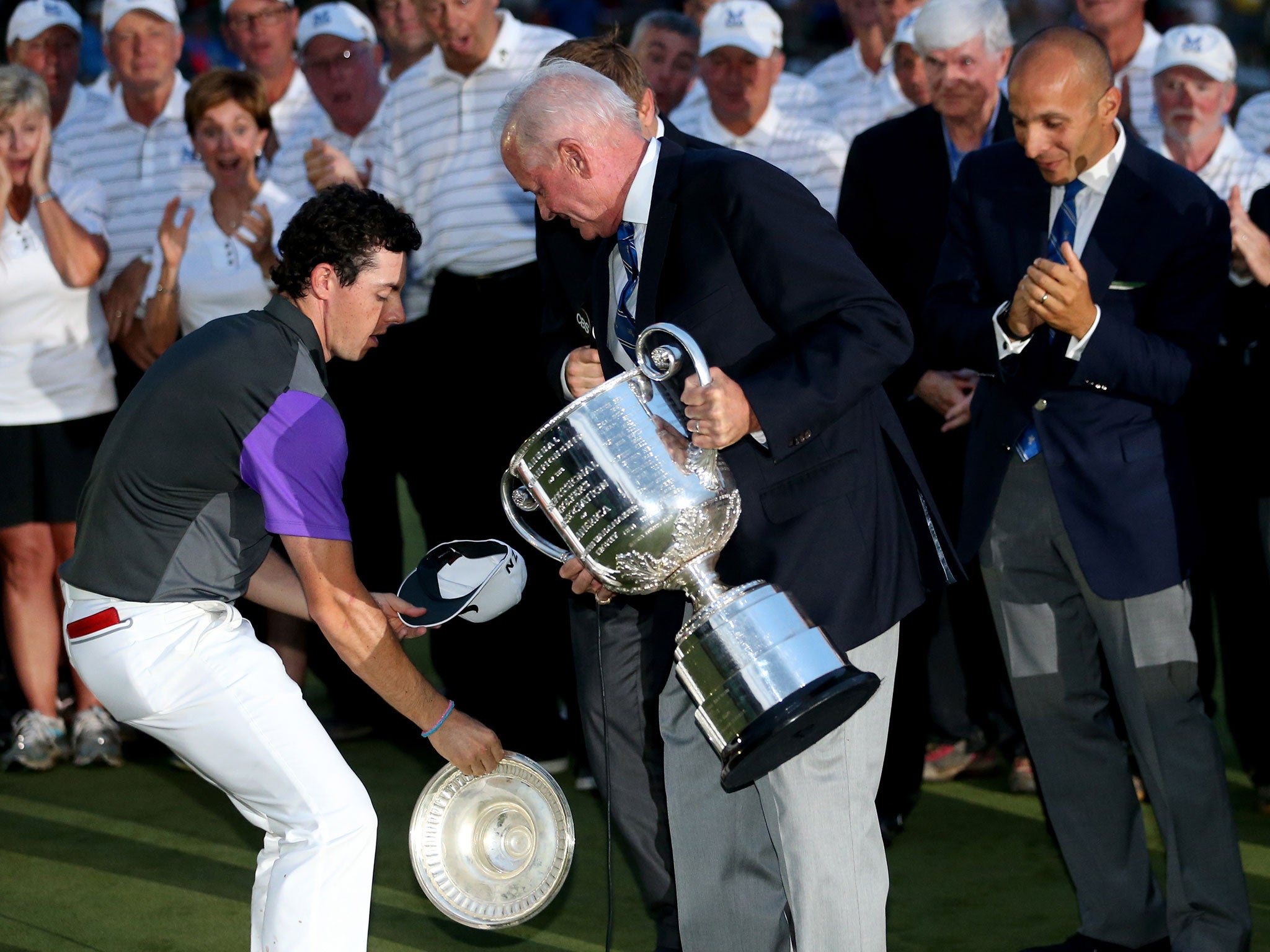 Rory McIlroy catches the lid of the Wanamaker Trophy after winning the US PGA Championship at Valhalla