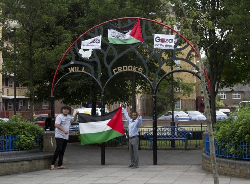 Residents show their solidarity with Gaza last week, but the black flag associated with the Islamic State came down