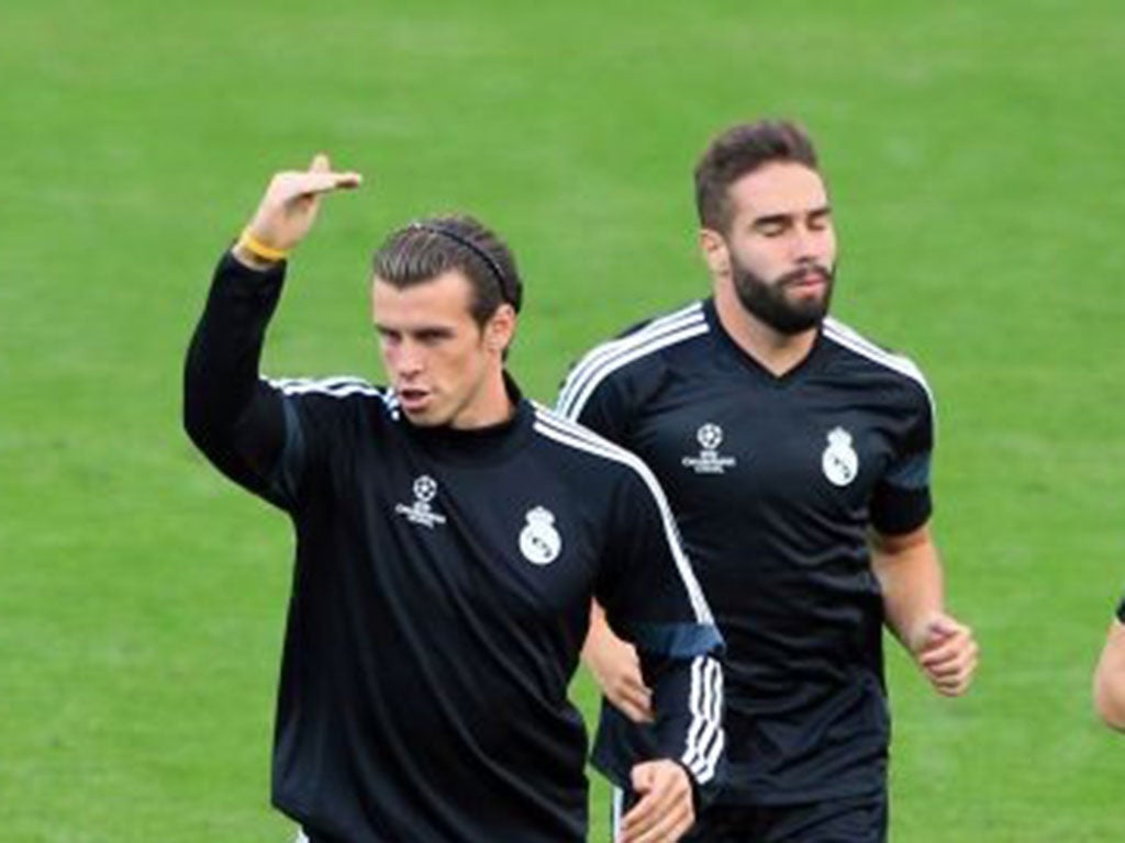 Gareth Bale, left, training with his Real Madrid team-mates at Cardiff City Stadium yesterday