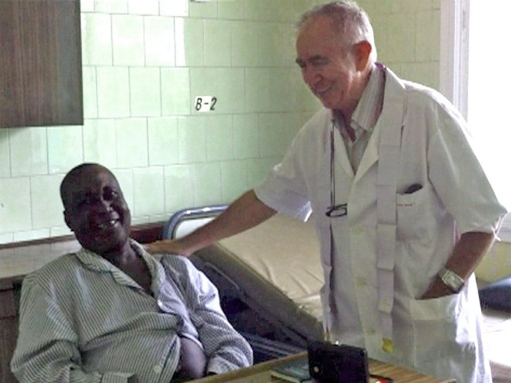 Spanish priest Miguel Pajares, who has died from Ebola, with a patient in Liberia