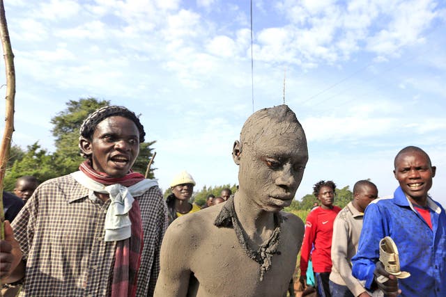 Bukusu villagers escort a teenager to the circumcision ritual in the Bungoma region in western Kenya