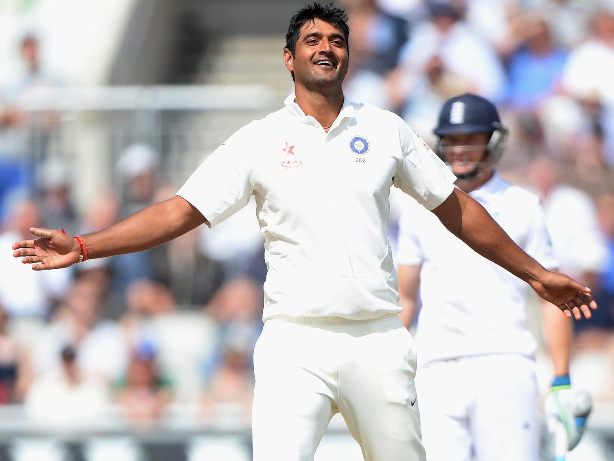 Pankaj Singh, who has begun to enjoy a cult following among cricket devotees, celebrates taking his first Test wicket at Old Trafford last week