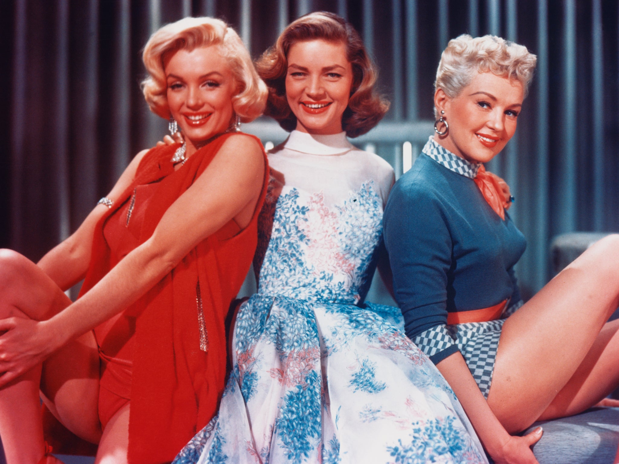 American actresses (L to R) Marilyn Monroe, Lauren Bacall and Betty Grable in a promotional portrait for 'How To Marry A Millionaire', directed by Jean Negulesco, 1953