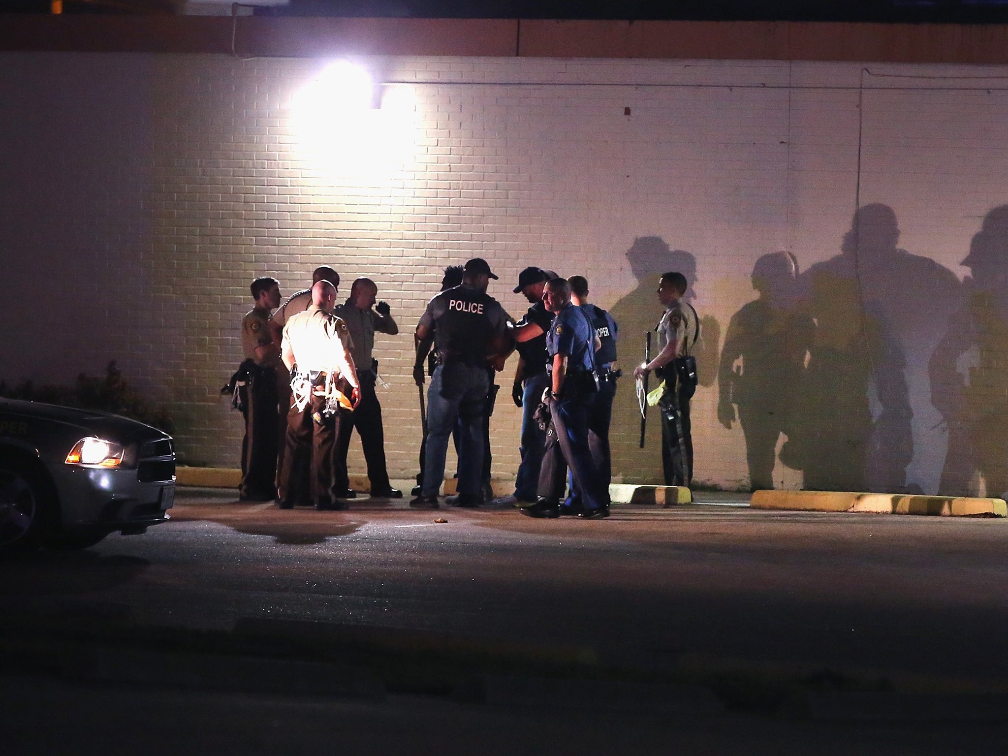 Police detain a man in Ferguson, Missouri