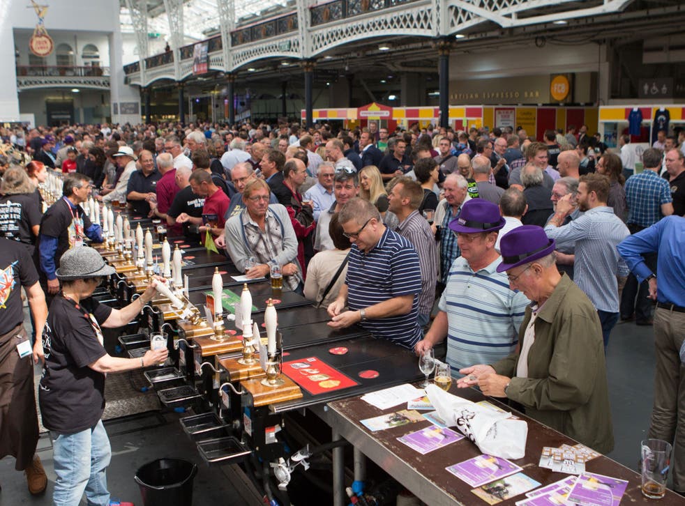 Attendees enjoy and taste different types of beer across Britain at the Great British Beer Festival (GBBF) in  Olympia London, Keningston
