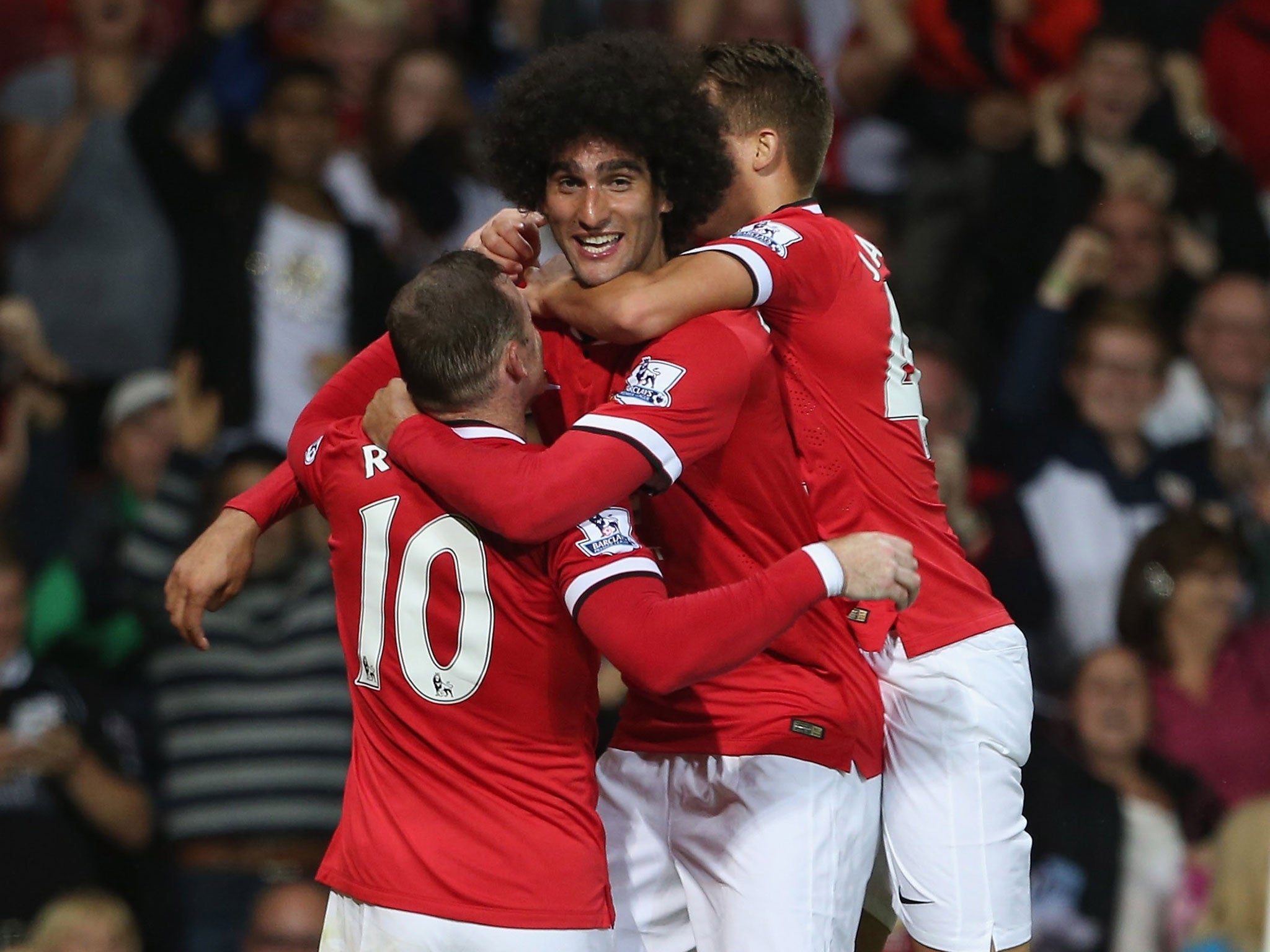 Marouane Fellaini celebrates scoring for United on Tuesday