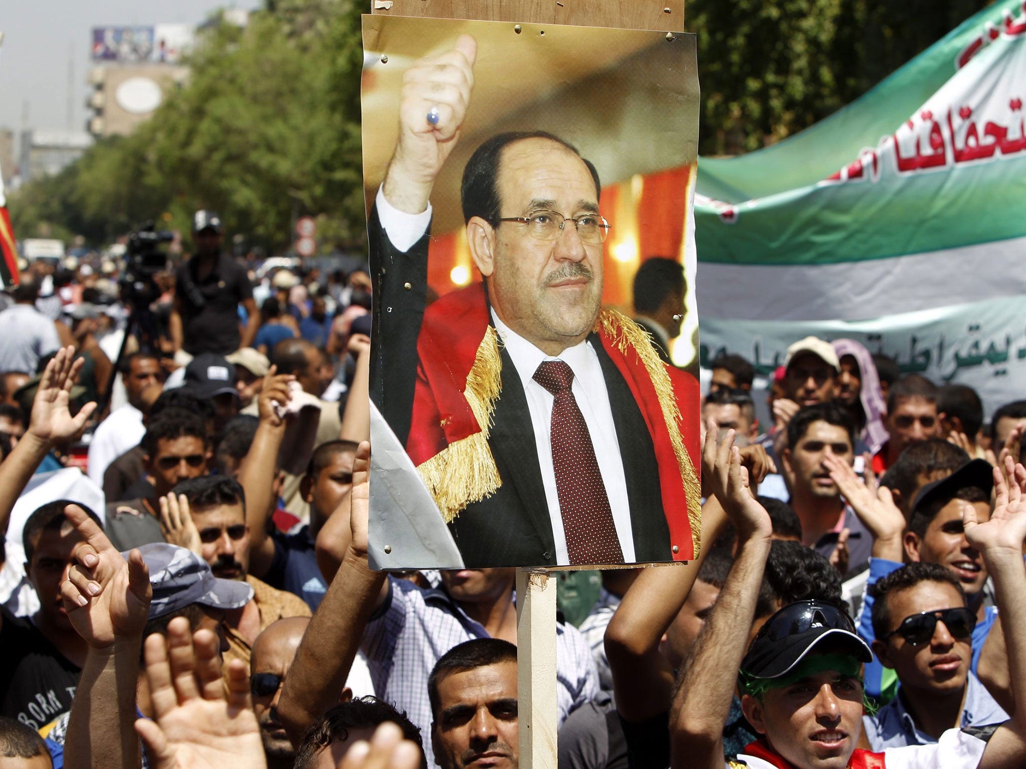 Supporters of Iraq’s embattled Prime Minister, Nouri al-Maliki, demonstrate in Baghdad