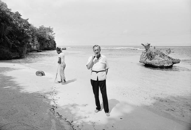 Smoking gun: Ian Fleming, on a beach near Goldeneye, 1964