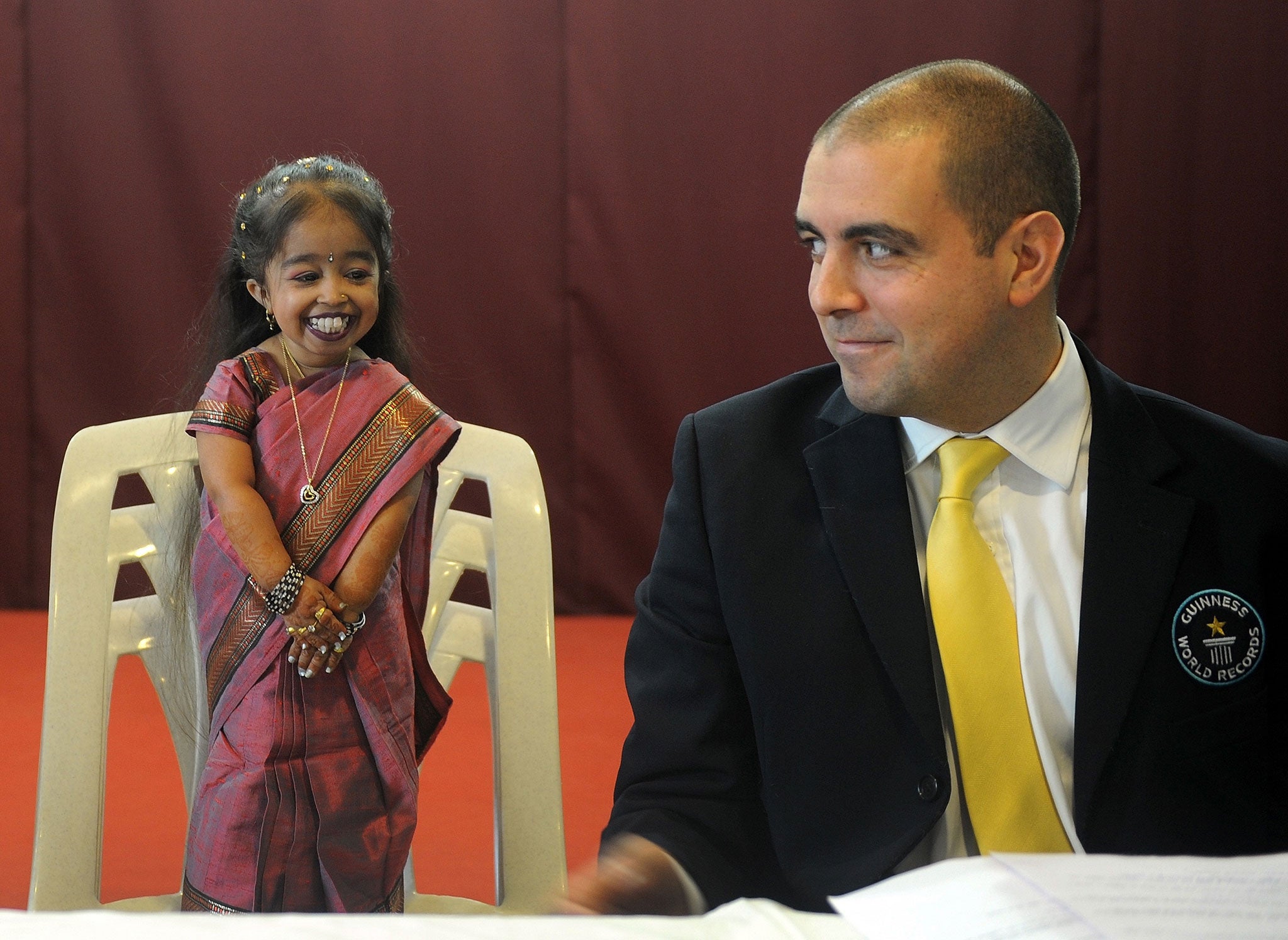 Jyoti Amge with Guinness World Records adjudicator Rob Molloy at a news conference in Nagpur, India