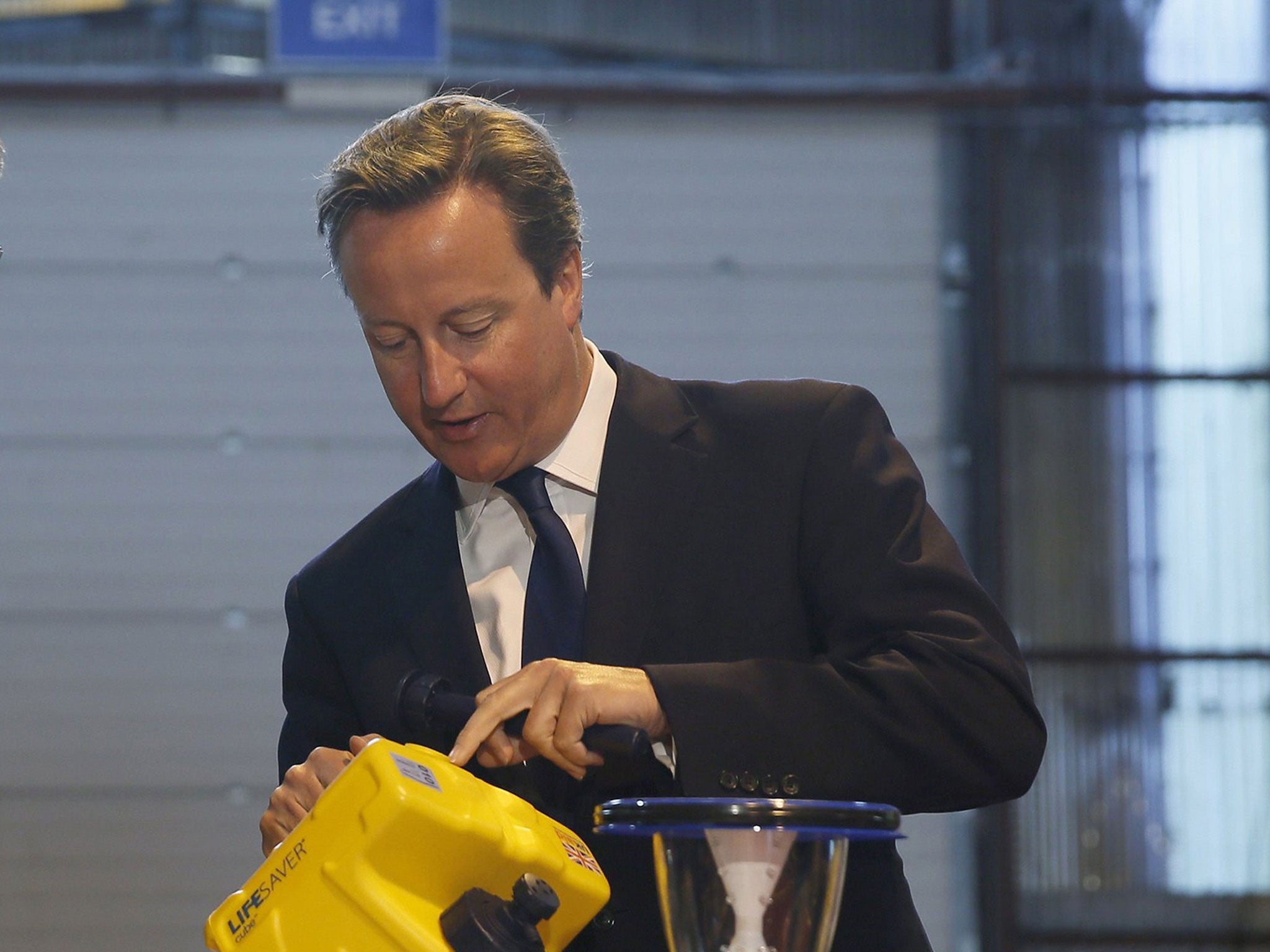 David Cameron examines a water purifier