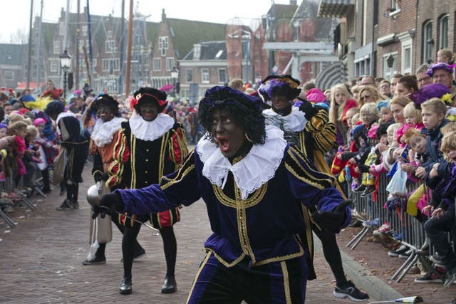 Zwarte Pieten ("Black Petes") entertain the children at the opening of the Sinterklaas season in Hoorn