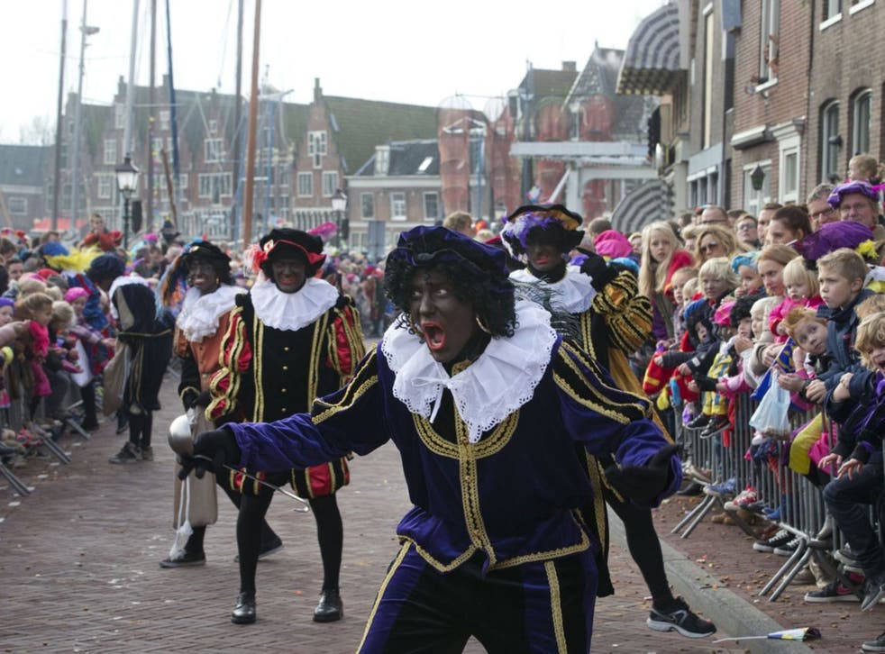 Black Petes or Zwarte Pieten entertain the children at the opening of the Sinterklaas season