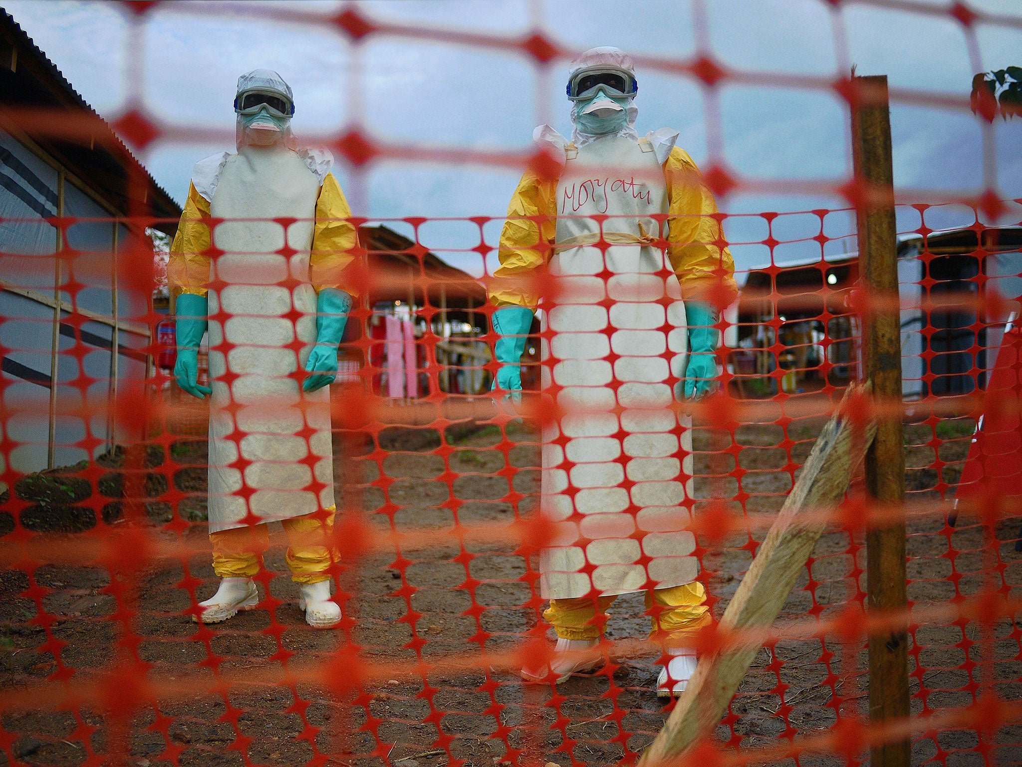 Medicins Sans Frontieres (MSF) medical staff members wearing protective clothing work as they deal with the Ebola outbreak